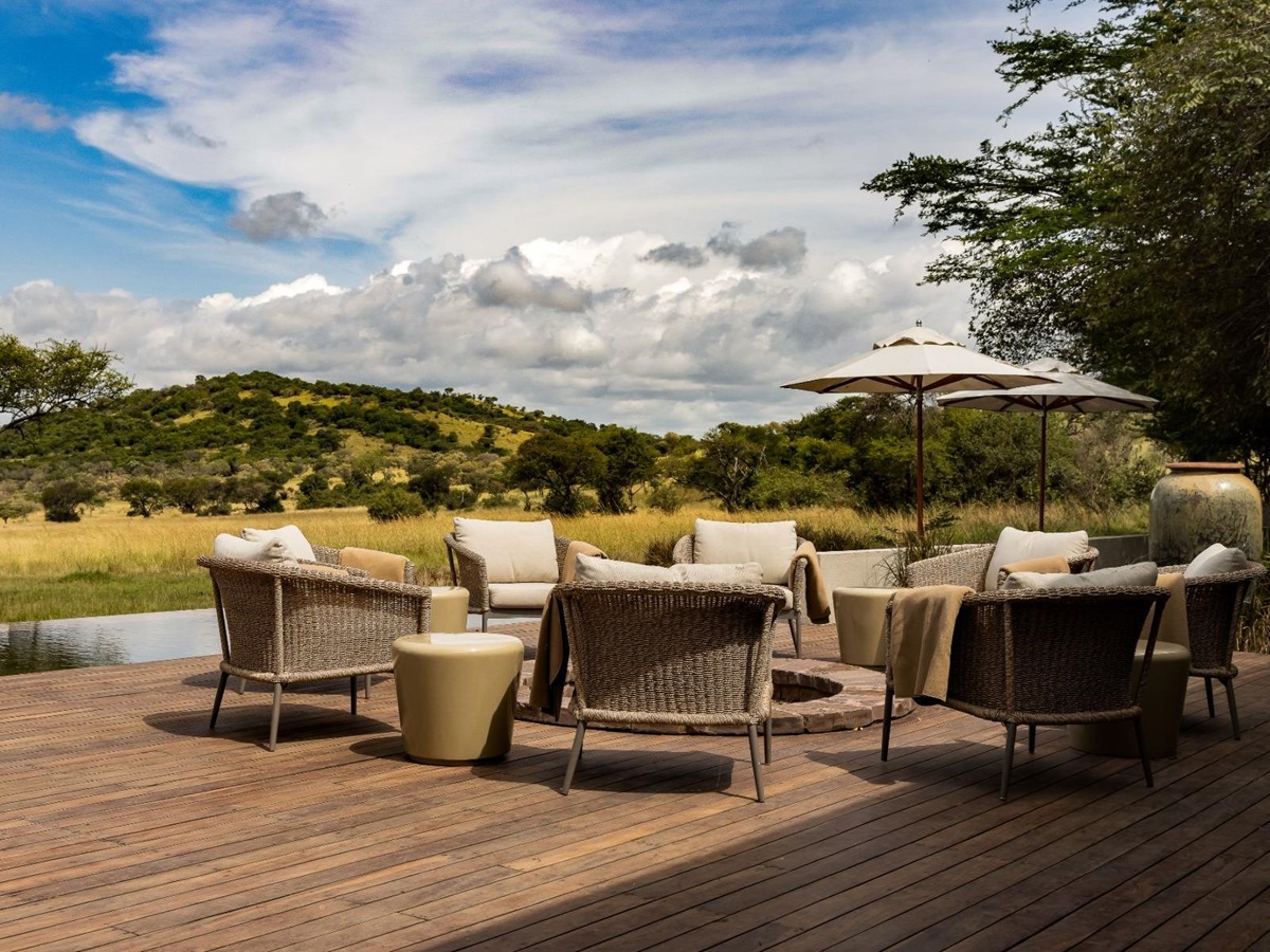 Fire pit and outdoor seating at Singita Serengeti House in Tanzania