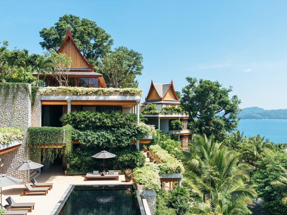 Exterior view of an outside terrace area and a 6 bedroom ocean villa at luxury resort Amanpuri
