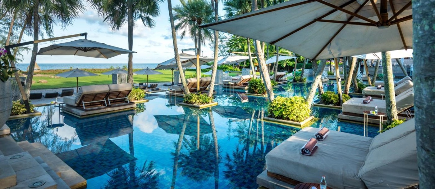 Pool and sunbeds at Anantara Mai Khao Phuket Villas in Thailand