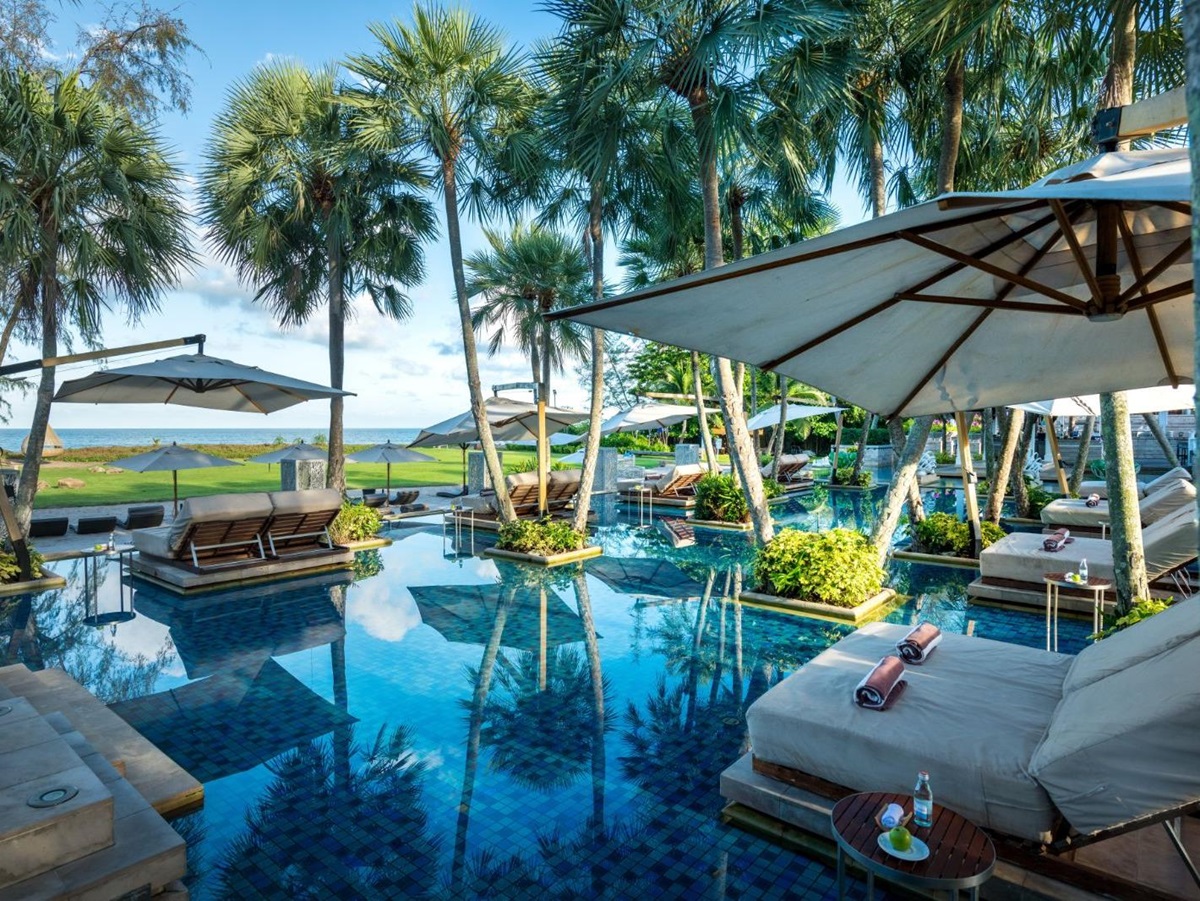 Pool and sunbeds at Anantara Mai Khao Phuket Villas in Thailand