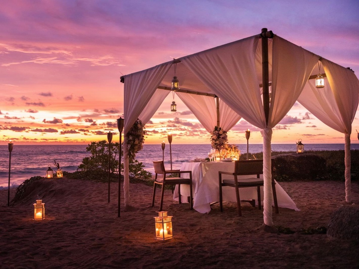 Private beach dining at Anantara Mai Khao Phuket Villas in Thailand