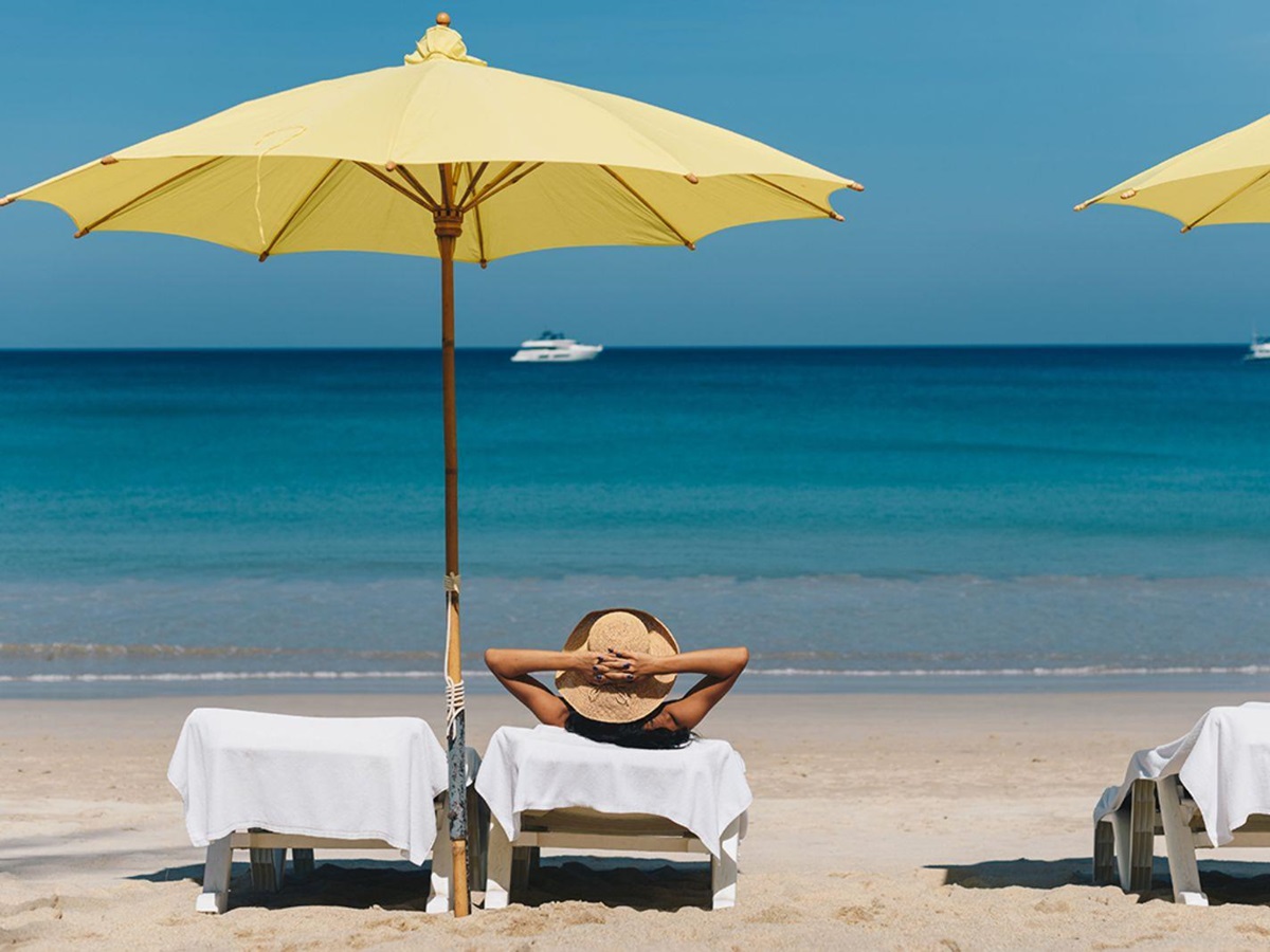 Sunbeds on the beach at Andara Resort & Villas in the Phuket region of Thailand