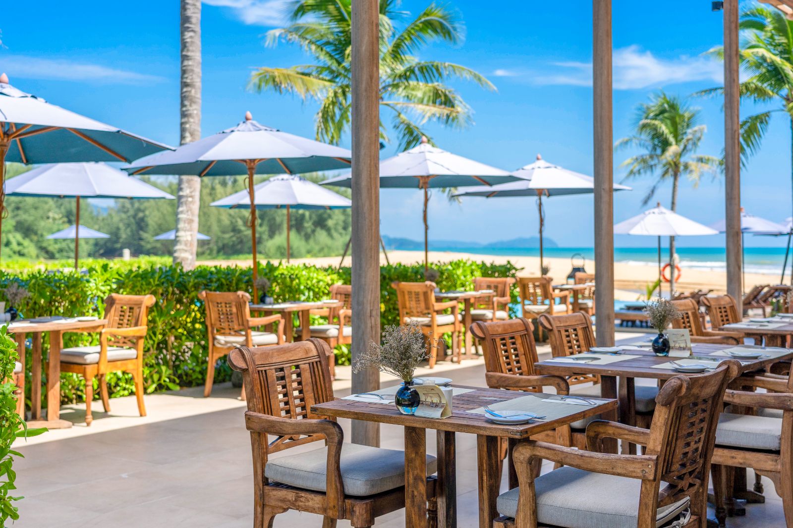Beach bar and grill outdoor terrace at Devasom Khao Lak on the south coast of Thailand
