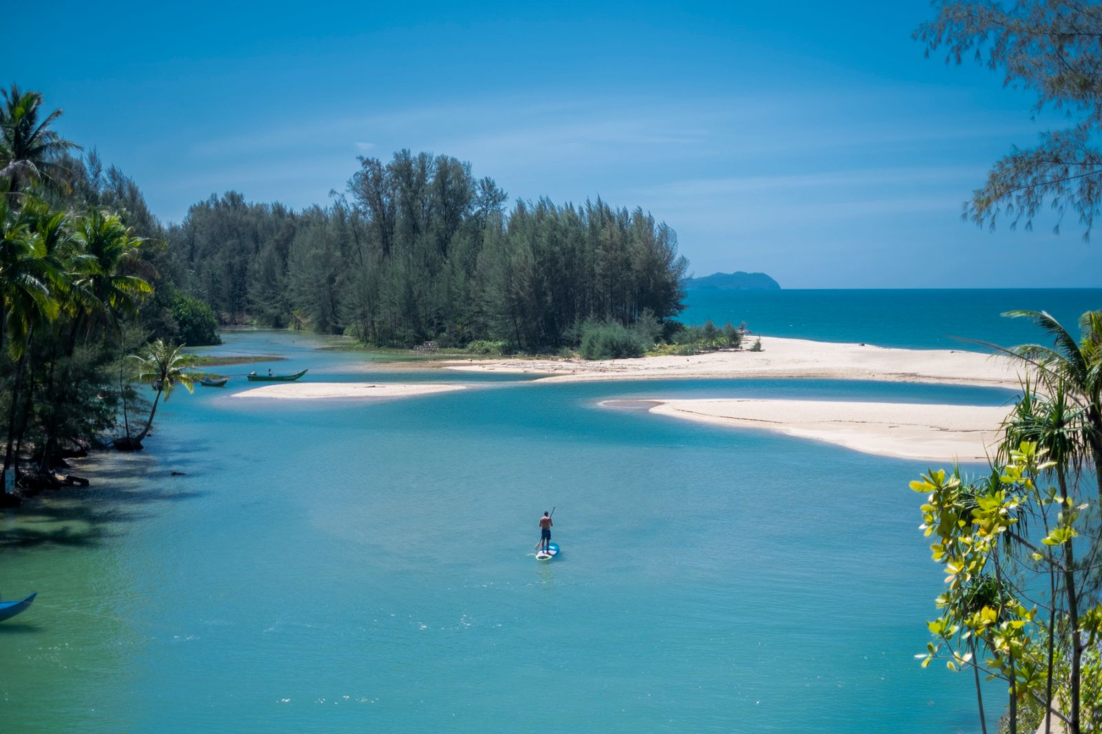 paddleboarding on the grounds of Devasom Khao Lak on the south coast of Thailand