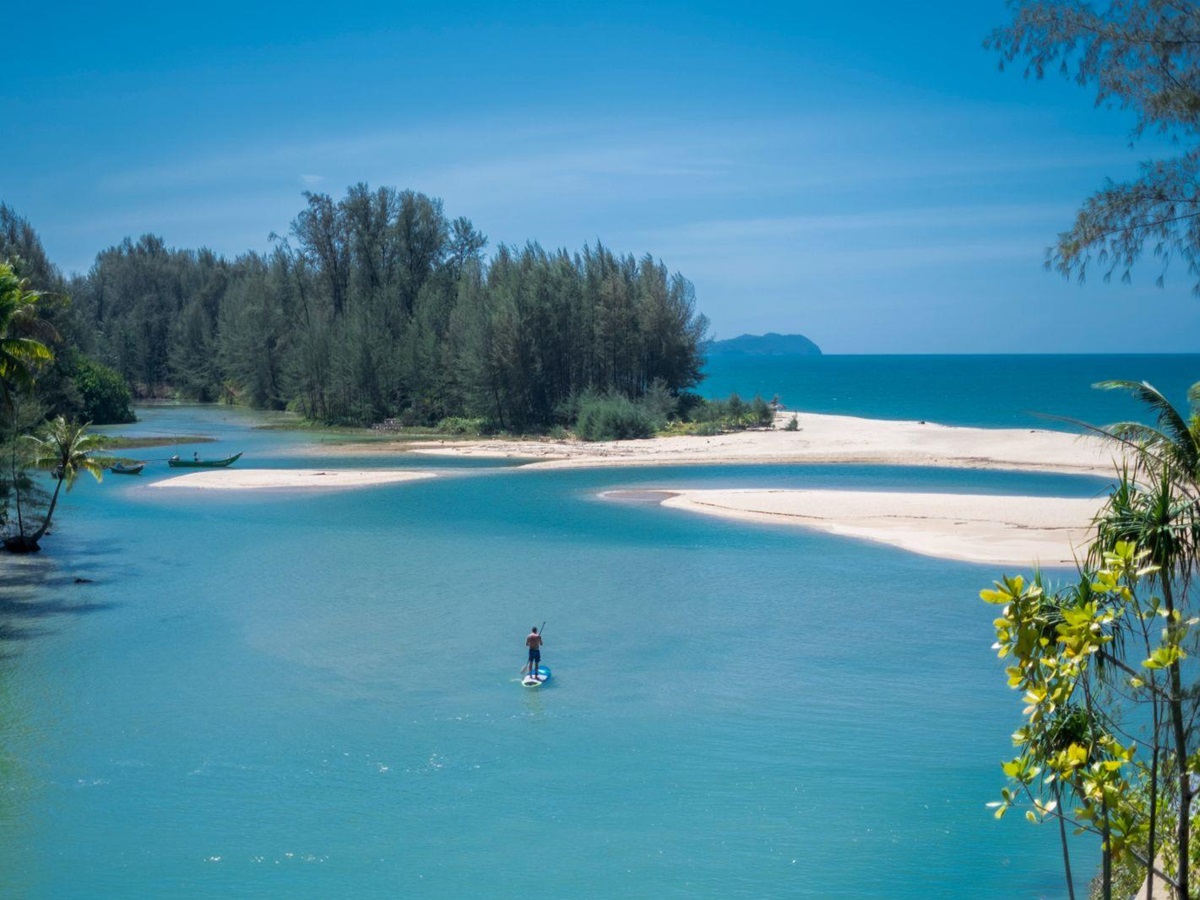 paddleboarding on the grounds of Devasom Khao Lak on the south coast of Thailand