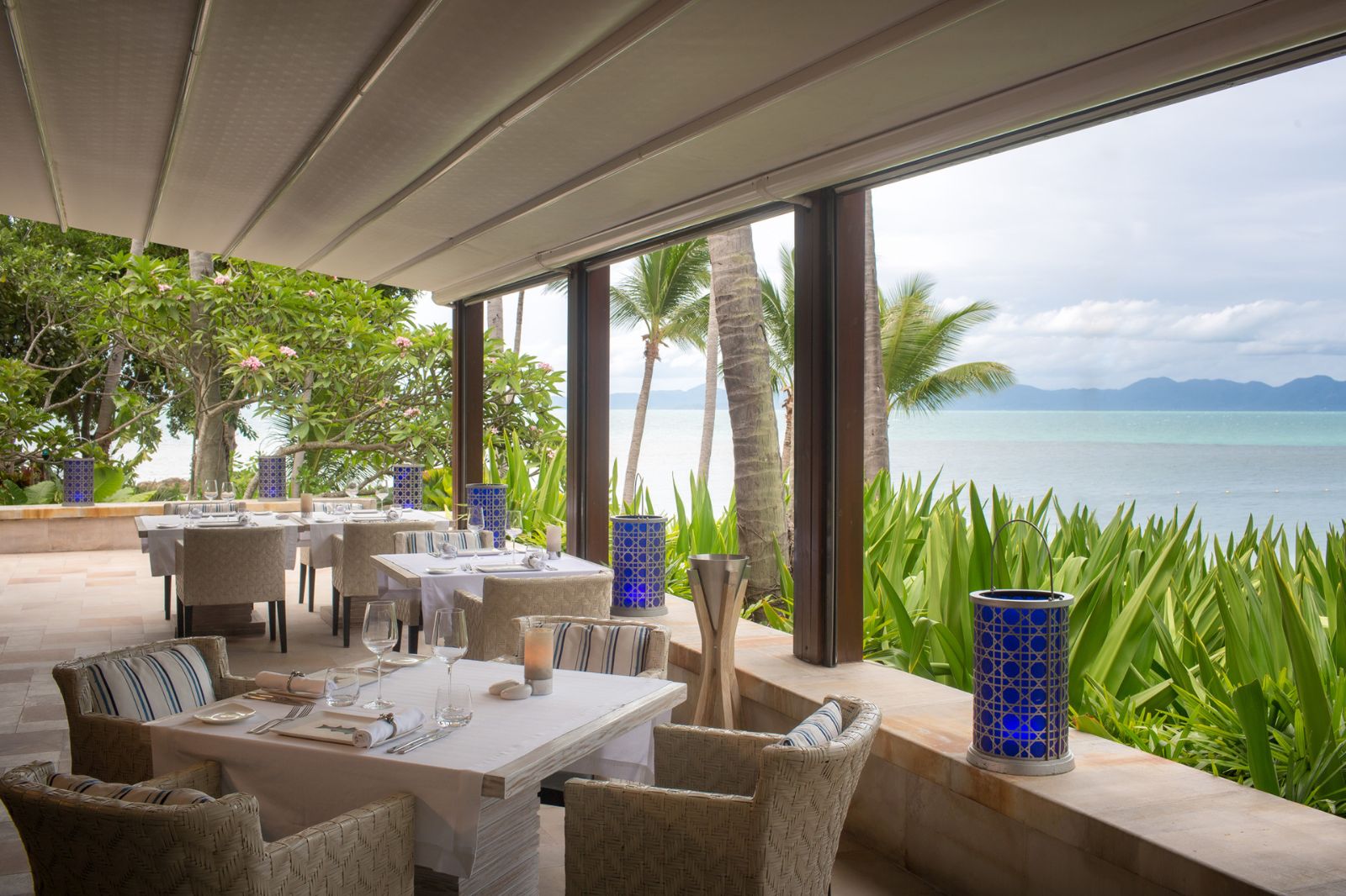 Dining tables prepared for daytime meals at Four Seasons Resort Koh Samui in Thailand