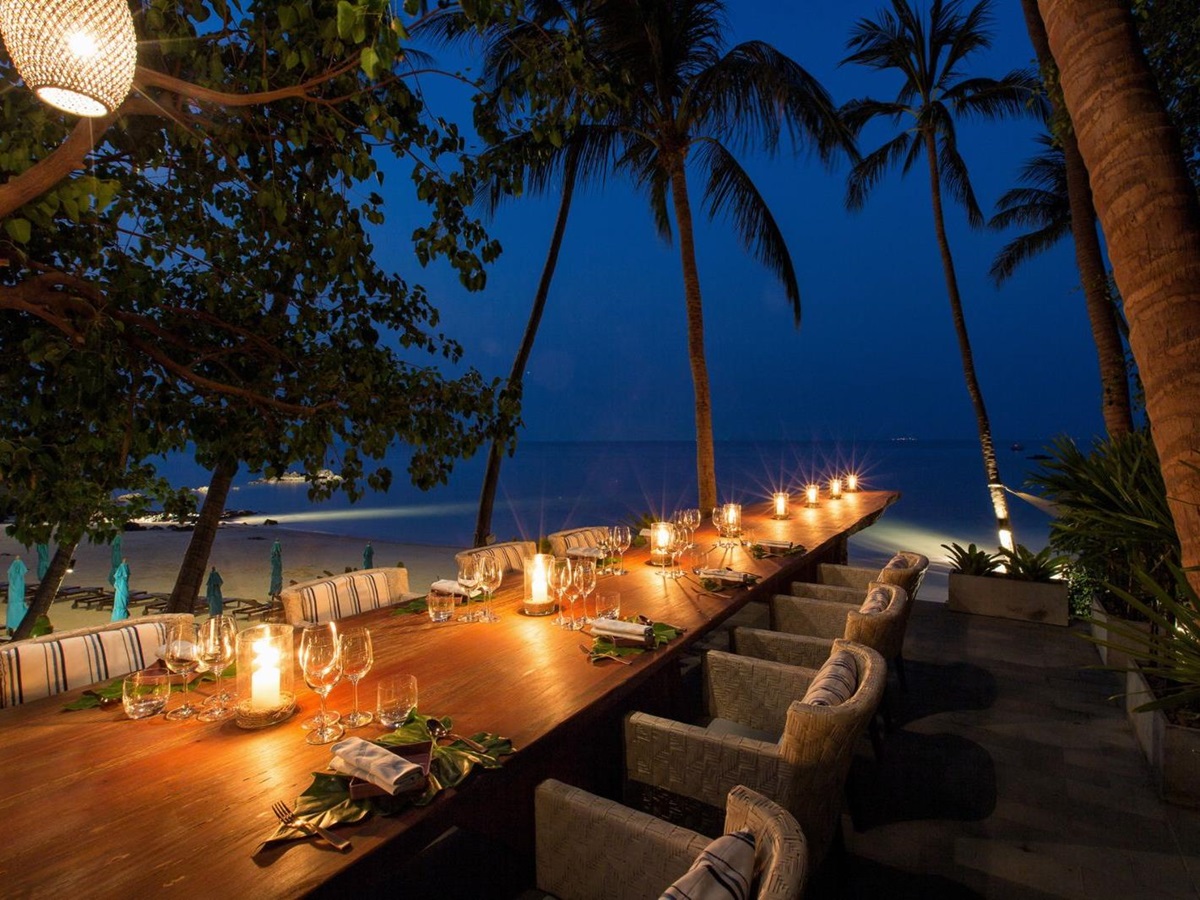 Dining table set for evening meals at Four Seasons Resort Koh Samui in Thailand