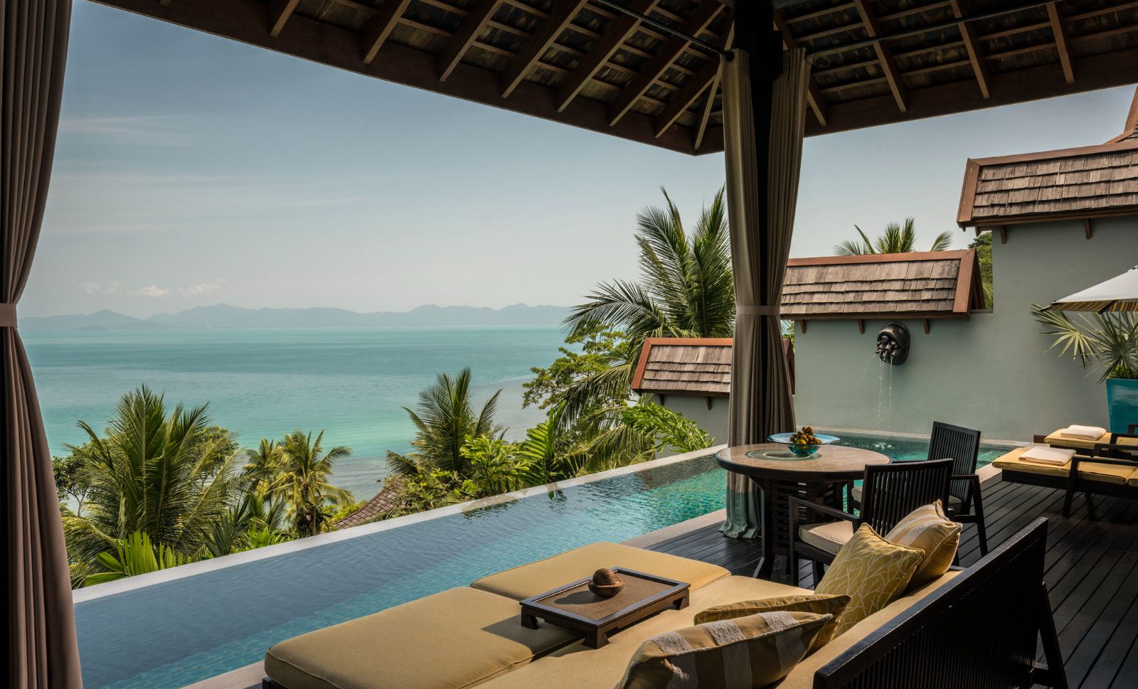 Guest suite lounge with pool and sea views at Four Seasons Resort Koh Samui in Thailand