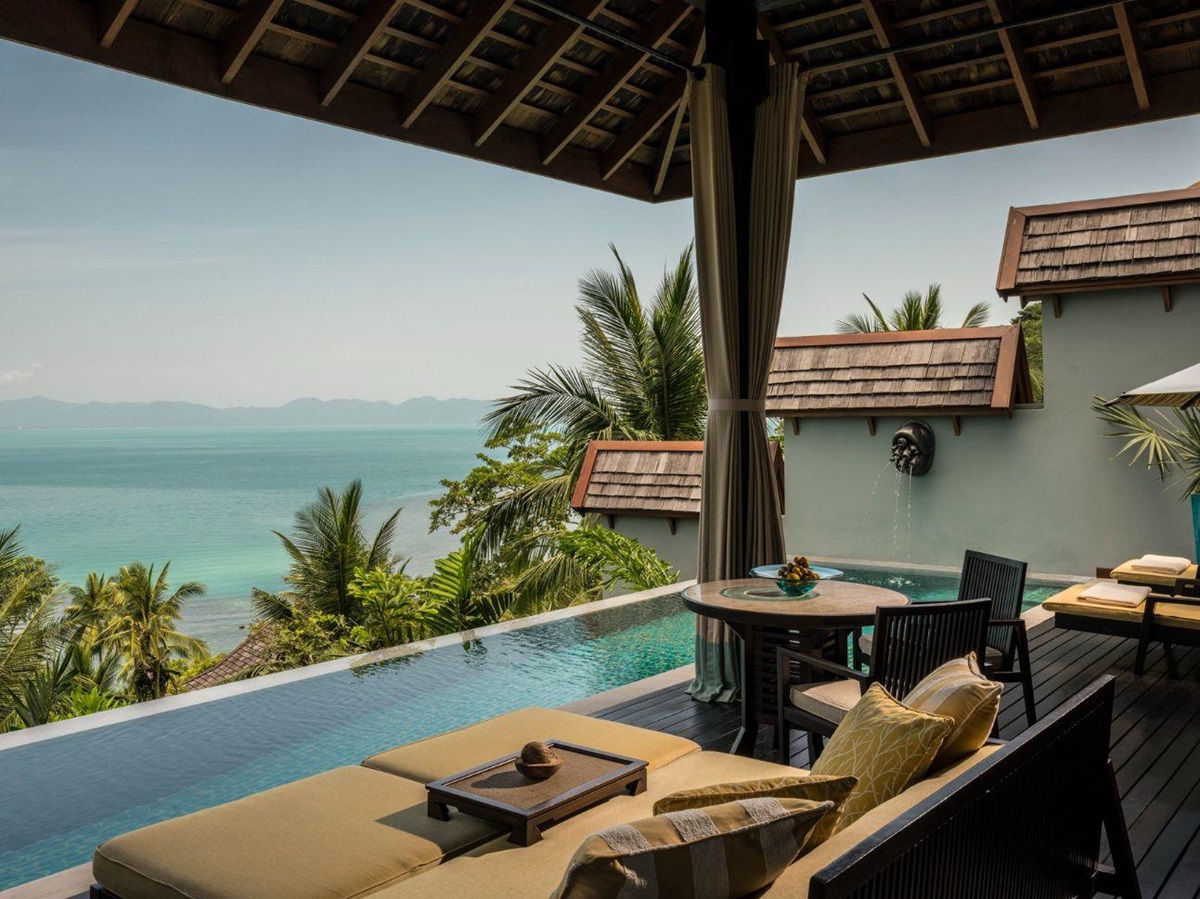Guest suite lounge with pool and sea views at Four Seasons Resort Koh Samui in Thailand