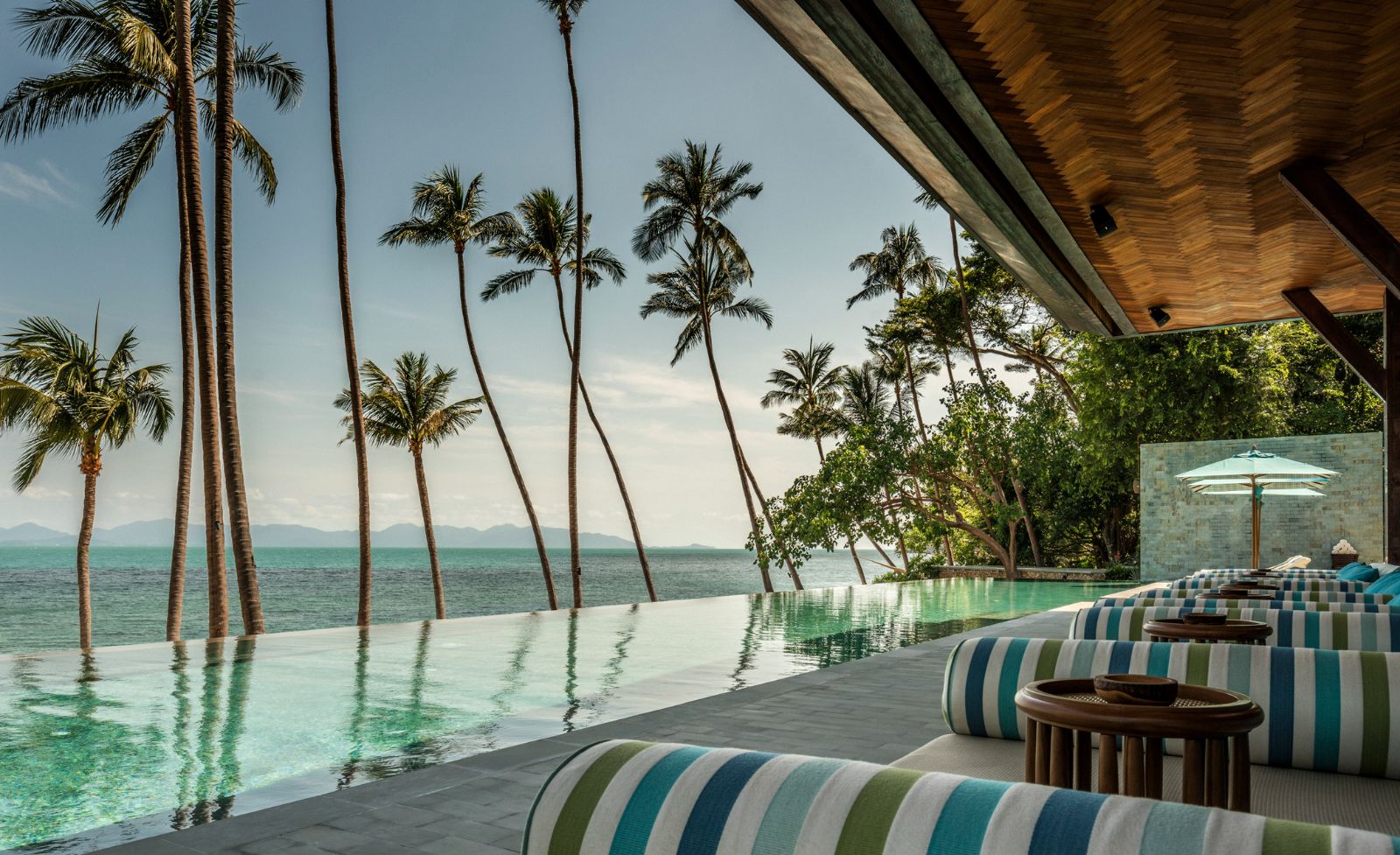 lounge with pool and sea views at Four Seasons Resort Koh Samui in Thailand