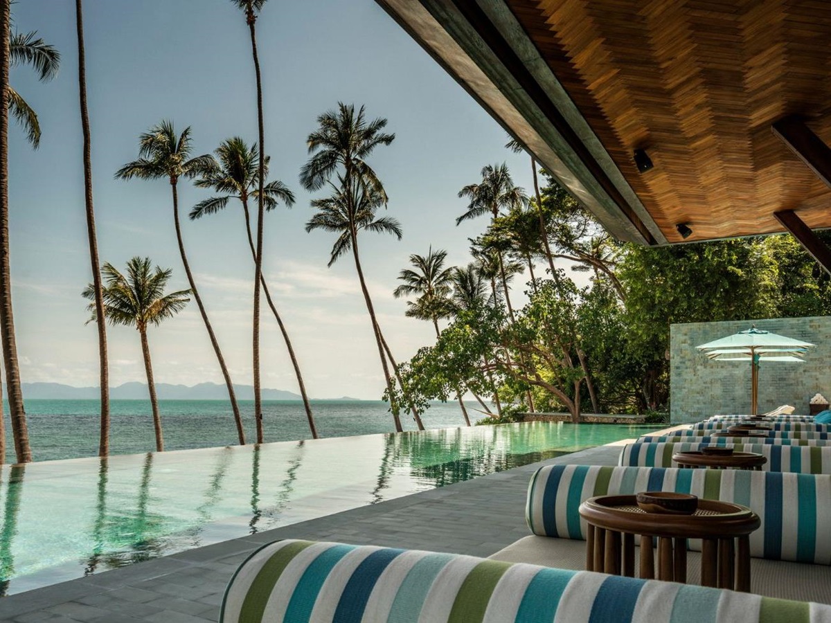 lounge with pool and sea views at Four Seasons Resort Koh Samui in Thailand