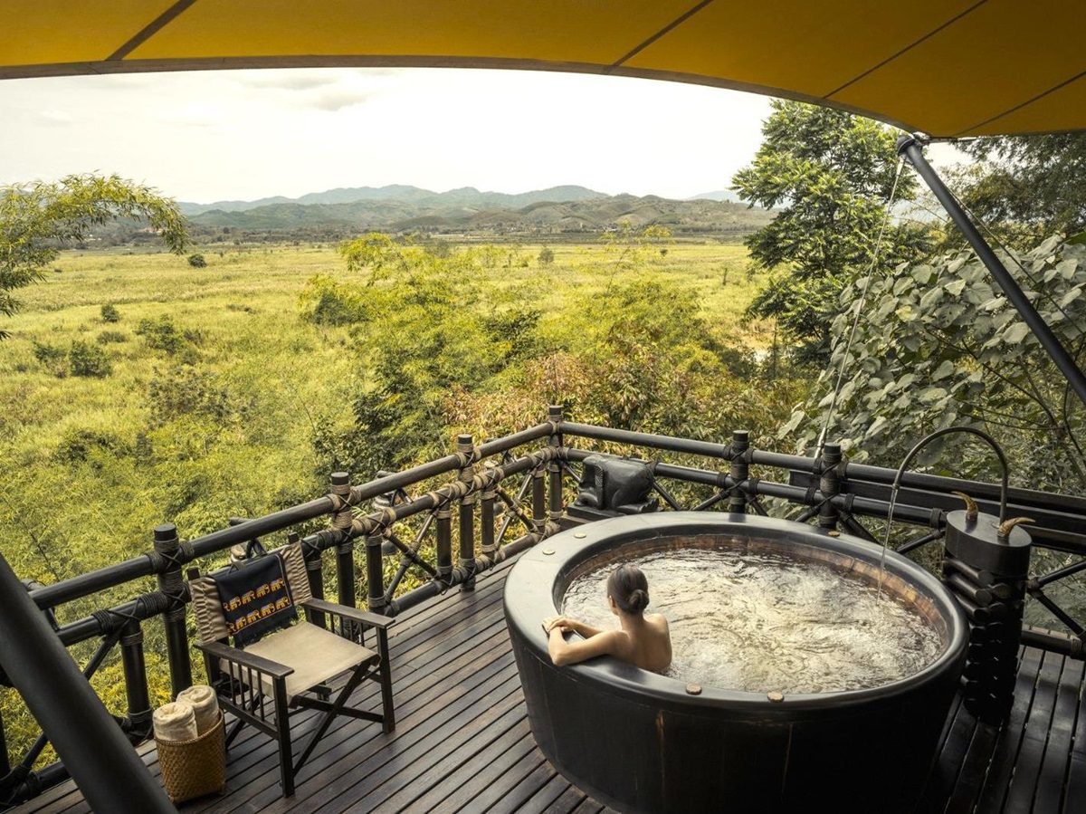 Jacuzzi on the deck of a tent at Four Seasons Tented Camp Golden Triangle in Chiang Rai