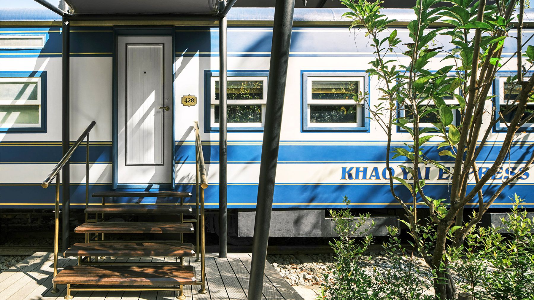 Exterior view of a train carriage suite at Intercontinental Khao Yai Resort in Thailand