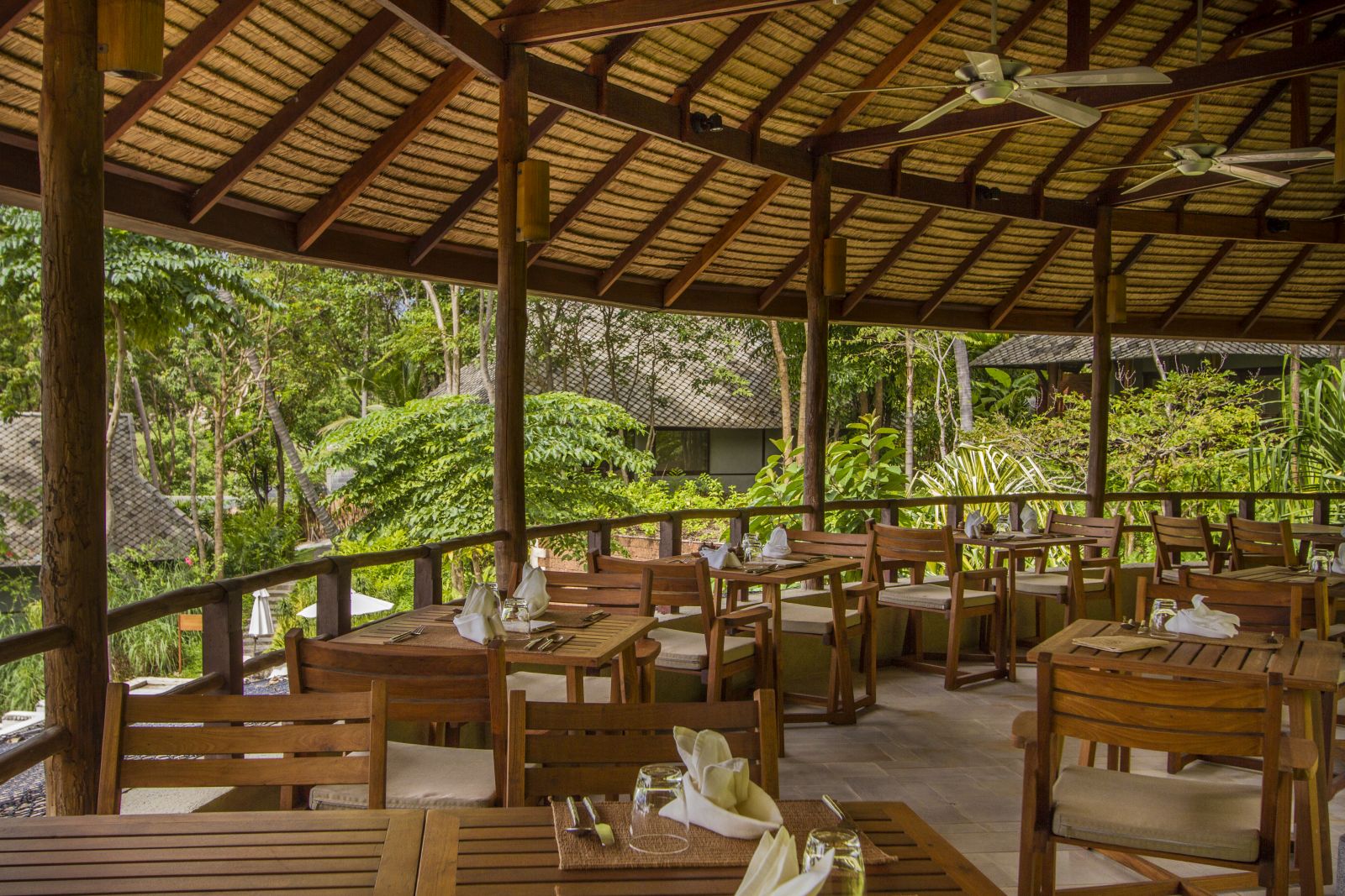 Dining overlooking the gardens at Amrita Cafe at luxury resort Kamalaya in Koh Samui, Thailand