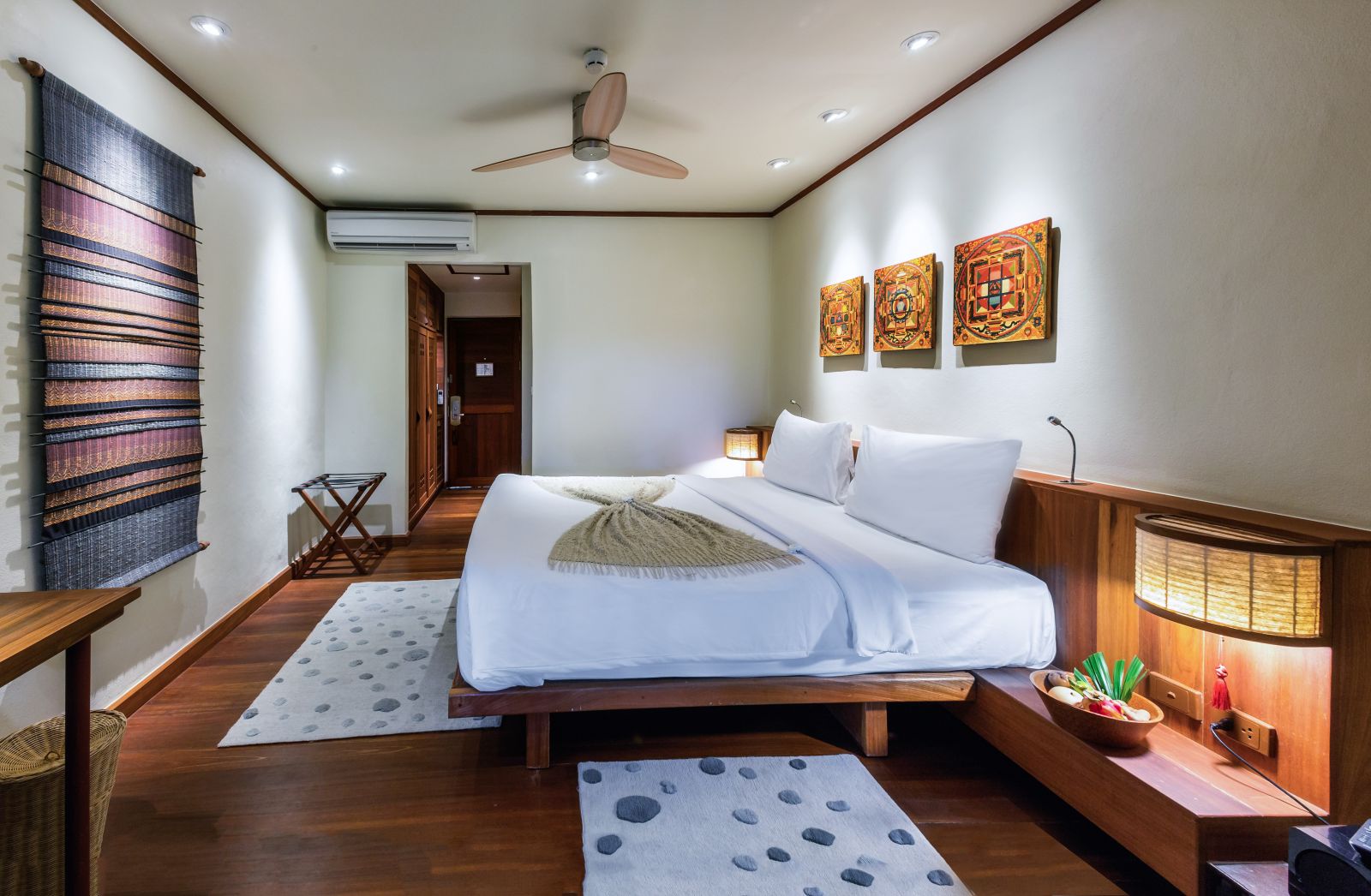 Garden View Room with double bed, Asian-style art and en-suite bathroom at at luxury wellness resort Kamalaya in Thailand