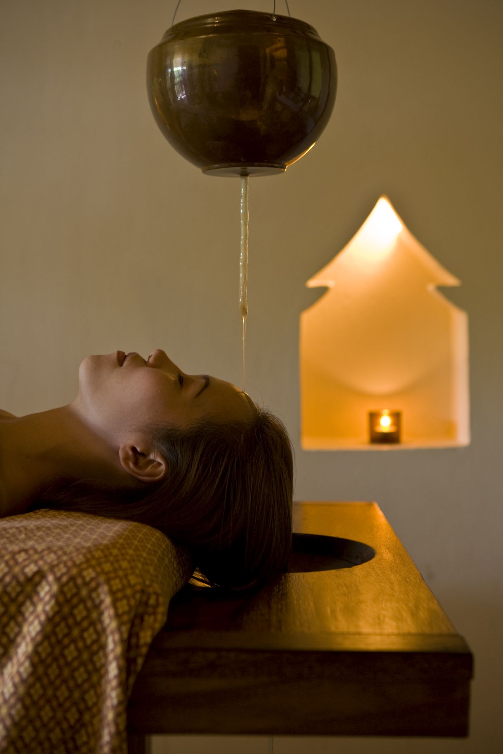 Woman enjoying a spa treatment at luxury wellness resort Kamalaya in Thailand