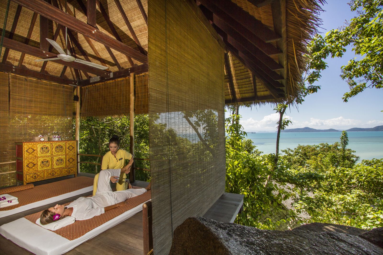 Spa treatment room with views over the gardens to the ocean at at luxury wellness resort Kamalaya in Thailand