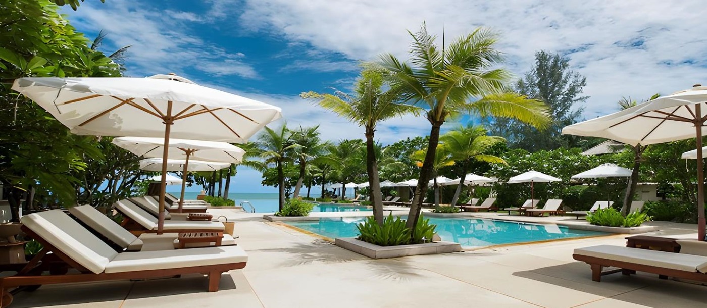 Sunbeds around the poolside at Layana Resort & Spa in the Koh Lanta region of Thailand