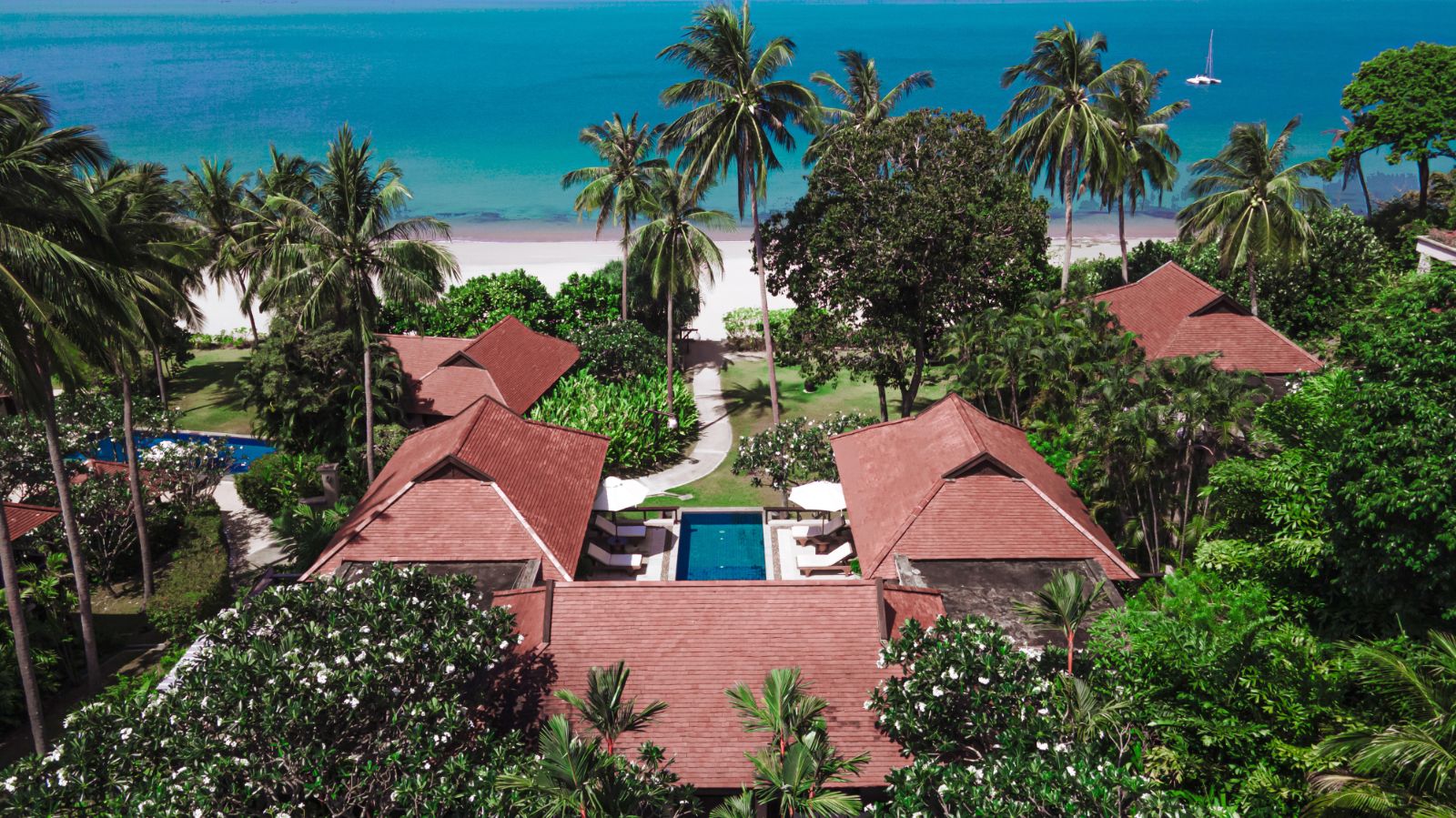 Exterior of beachside villa overlooking the sea at luxury resort Pimalai 