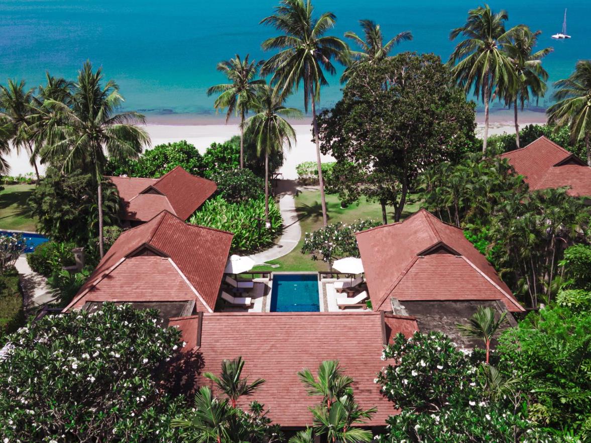 Exterior of beachside villa overlooking the sea at luxury resort Pimalai