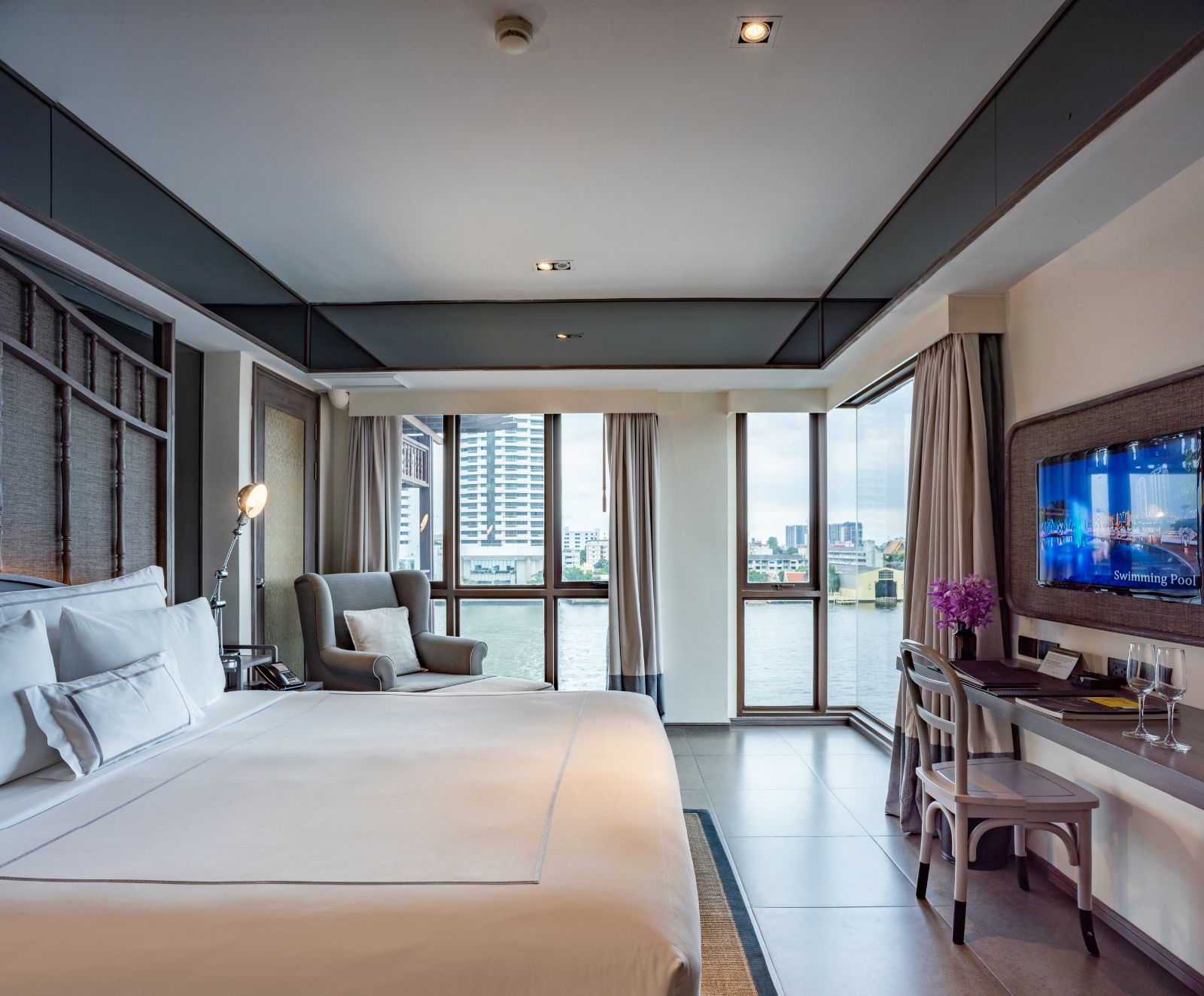 Panoramic Riva Room overlooking the river at luxury hotel Riva Surya in Bangkok, Thailand
