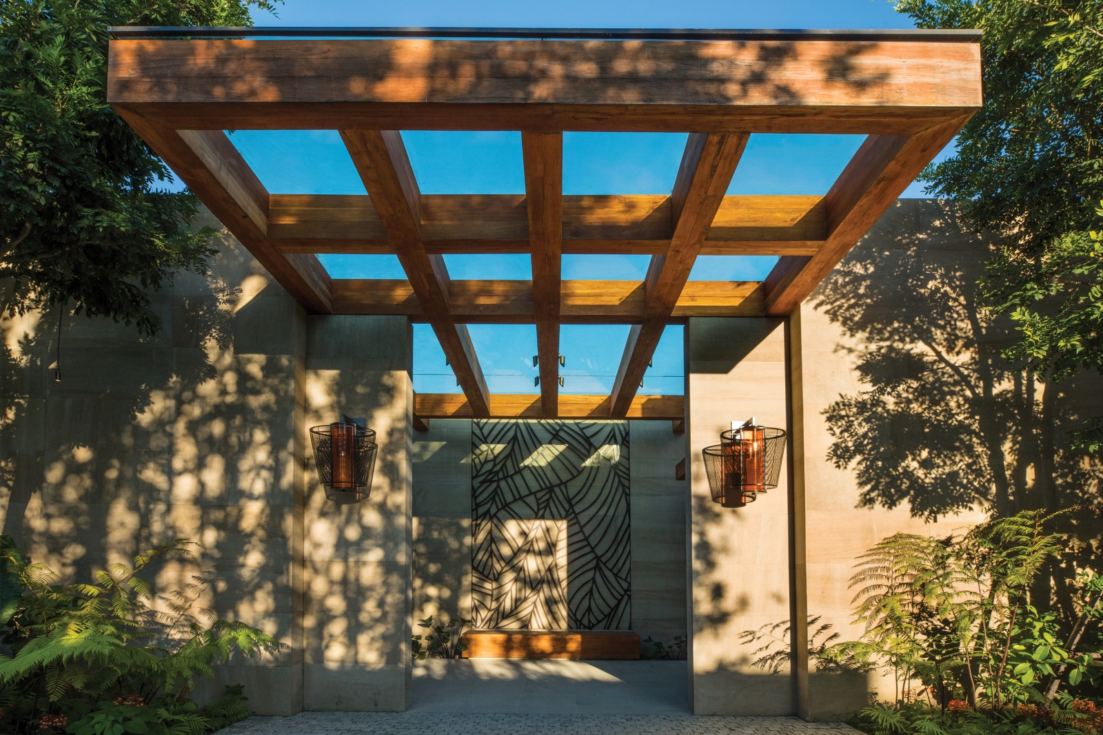 Covered spa entrance with dappled shade