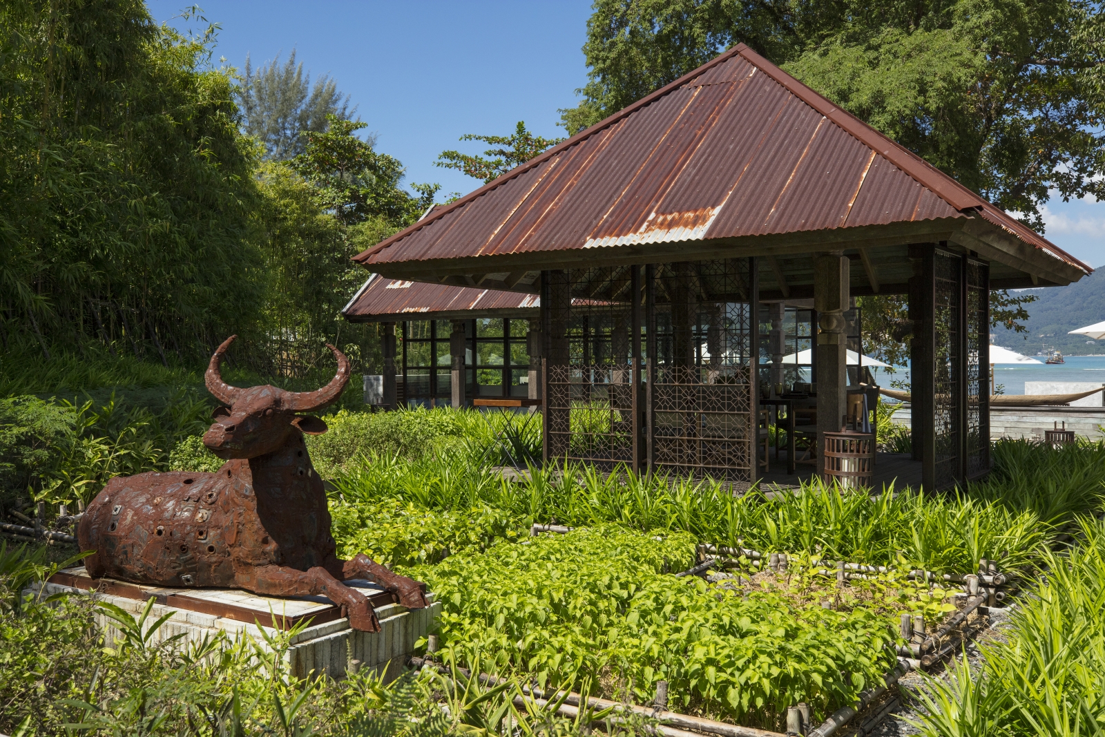 Exterior of Ta Khai restaurant with Bull statue