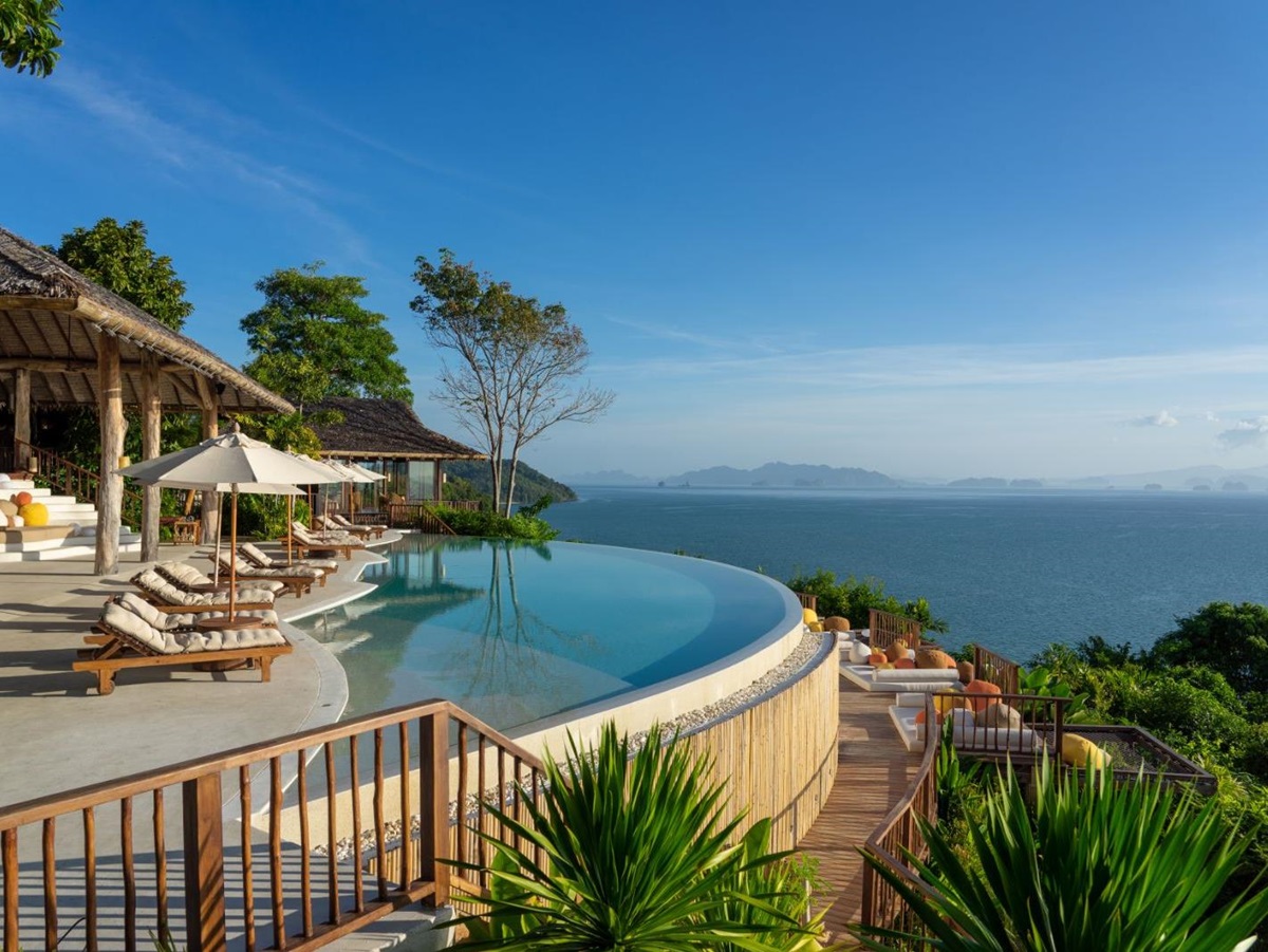 Swimming pool and lounge area at The Hilltop Bar at luxury resort Six Senses Yao Noi