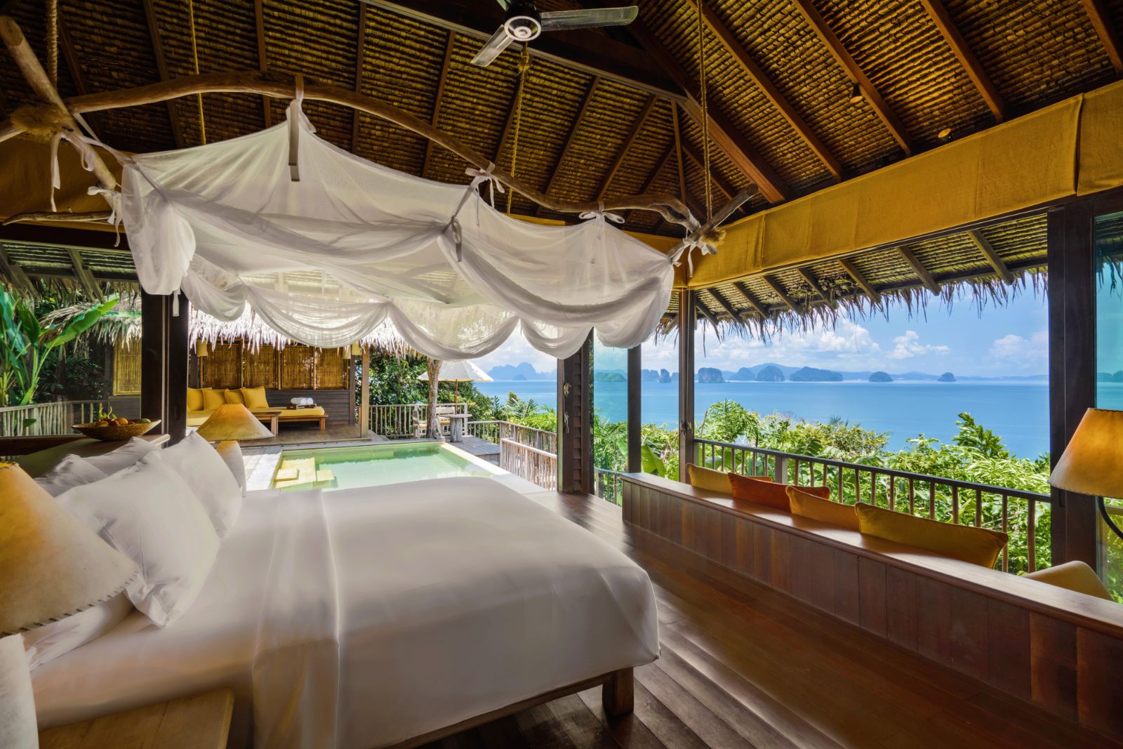 Bedroom looking out at the sea in a ocean panorama pool villa  at luxury resort Six Senses Yao Noi