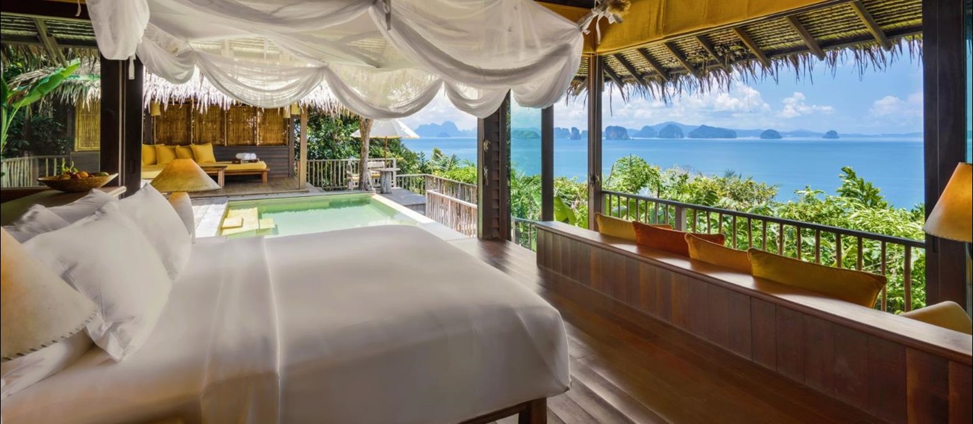 Bedroom looking out at the sea in a ocean panorama pool villa  at luxury resort Six Senses Yao Noi