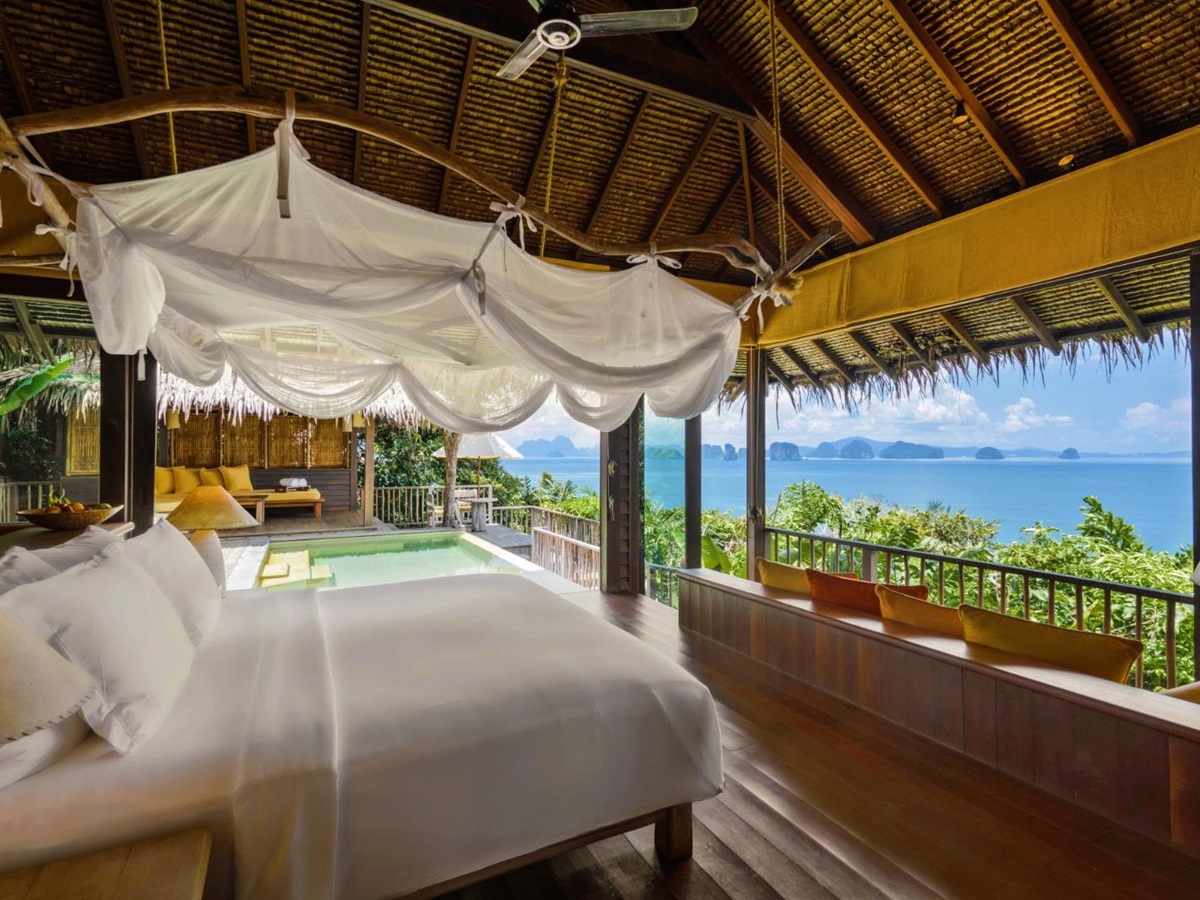 Bedroom looking out at the sea in a ocean panorama pool villa at luxury resort Six Senses Yao Noi