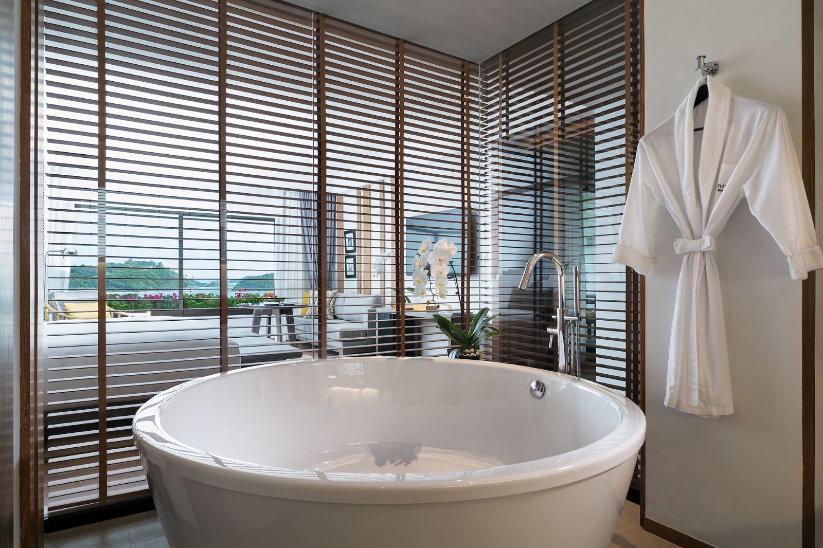 Guest suite bathroom with bathtub at The Nai Harn resort in the Phuket region of Thailand