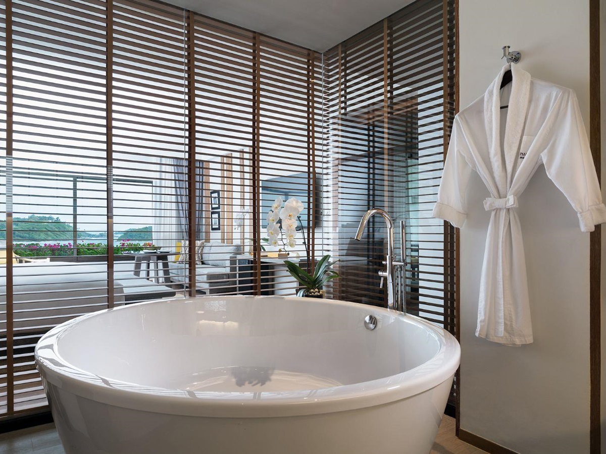 Guest suite bathroom with bathtub at The Nai Harn resort in the Phuket region of Thailand