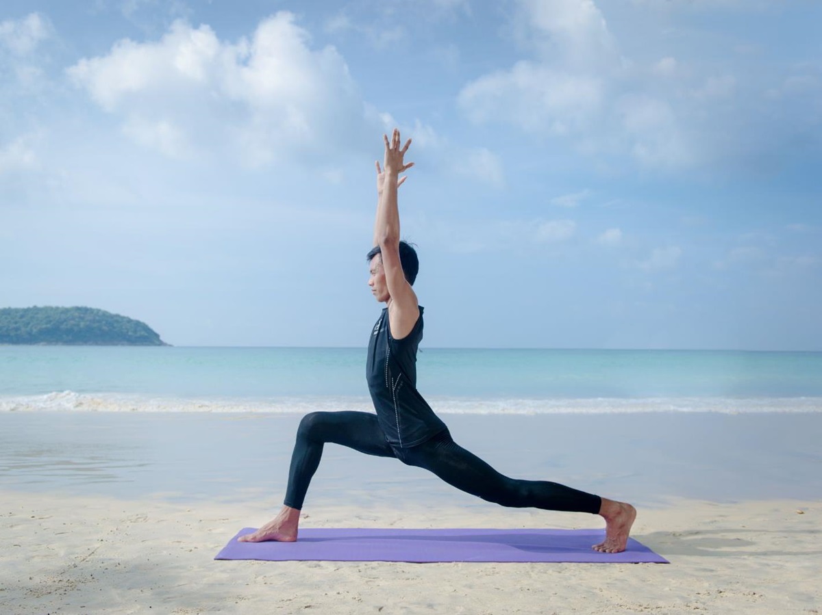 Beach yoga session at The Nai Harn resort in the Phuket region of Thailand