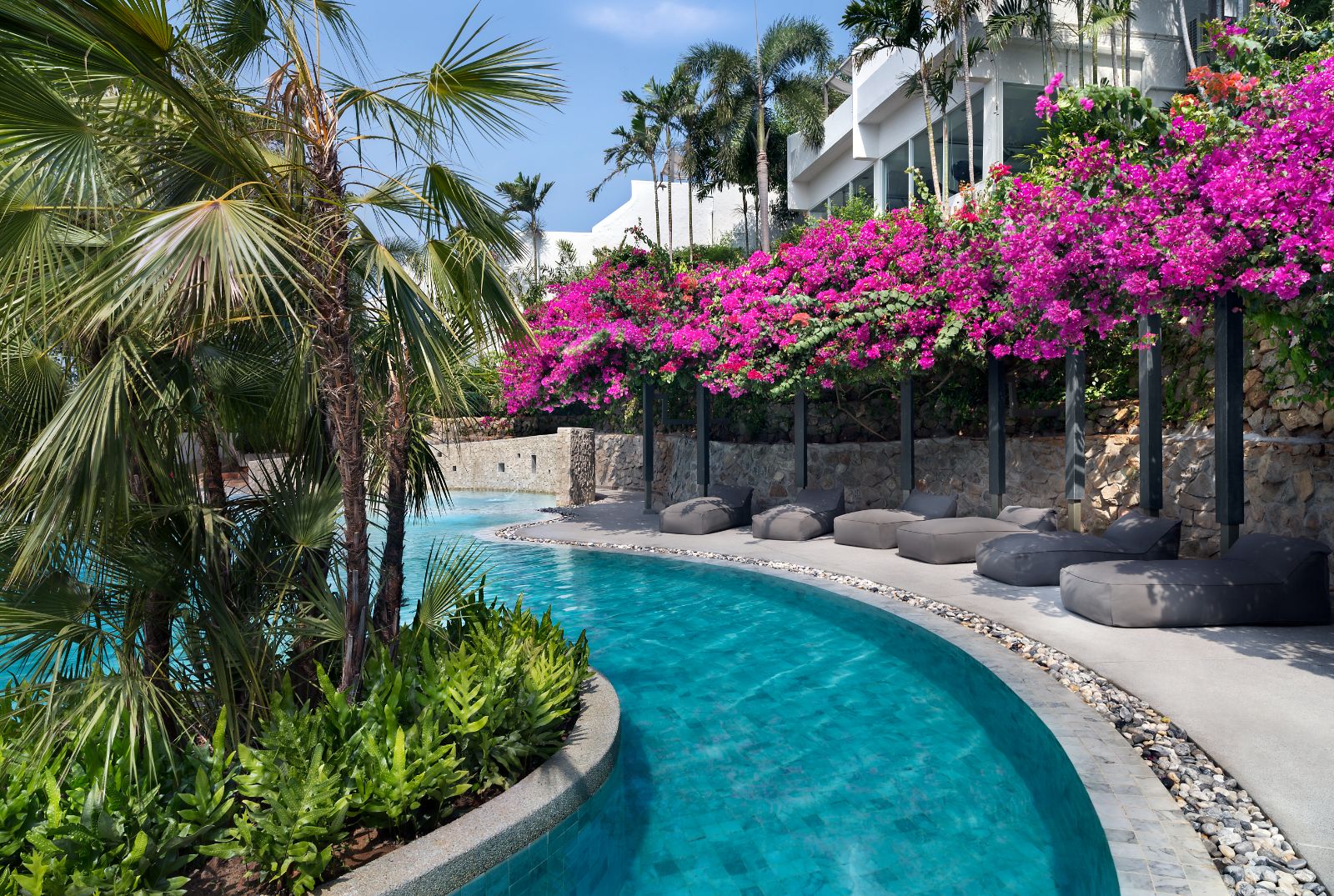 Curved edge pool at The Nai Harn resort in the Phuket region of Thailand