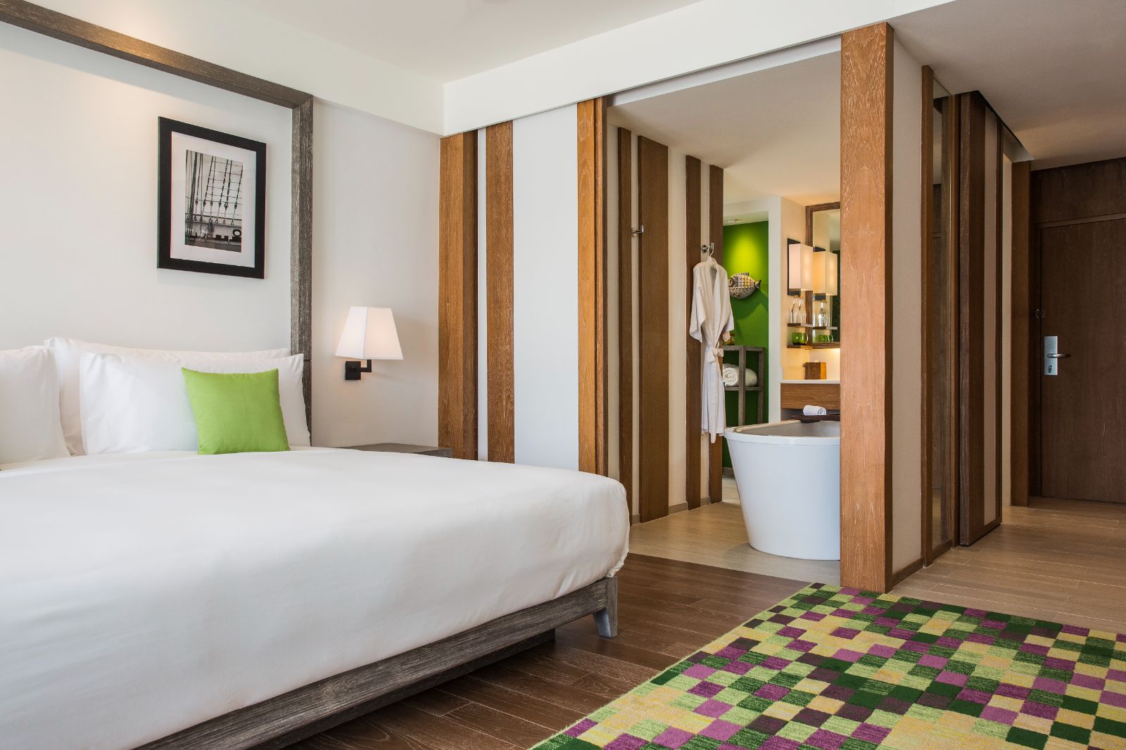 Deluxe ocean view guest suite bedroom at The Nai Harn resort in the Phuket region of Thailand