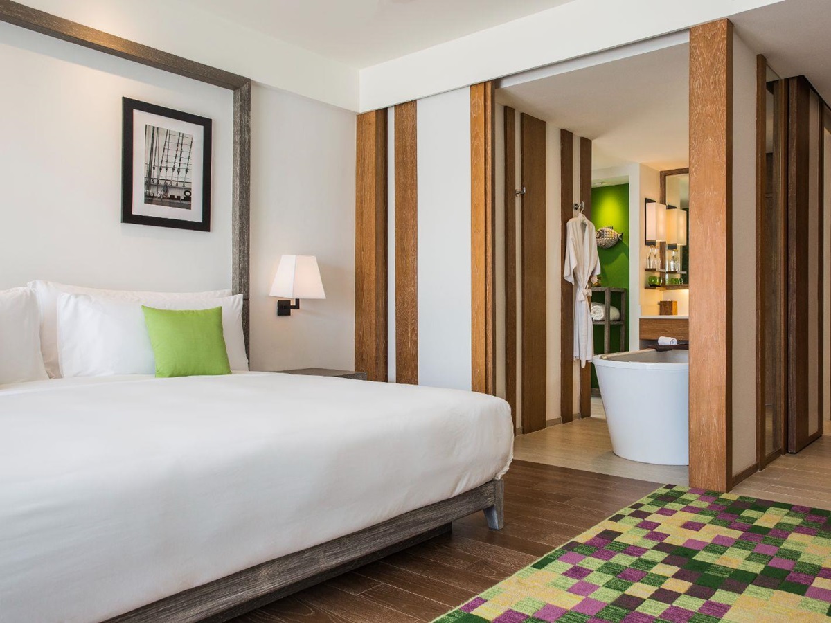 Deluxe ocean view guest suite bedroom at The Nai Harn resort in the Phuket region of Thailand