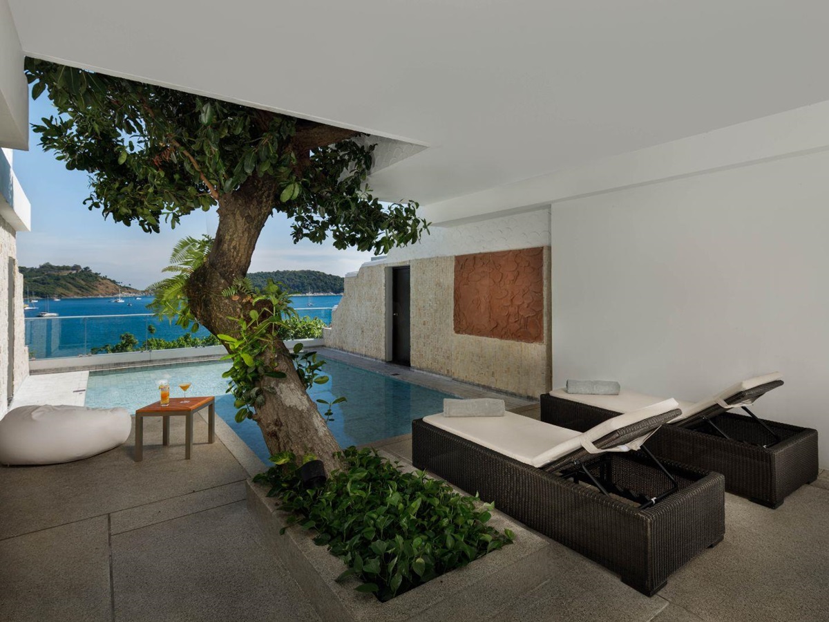 Family guest suite terrace with sunbeds and pool at The Nai Harn resort in the Phuket region of Thailand