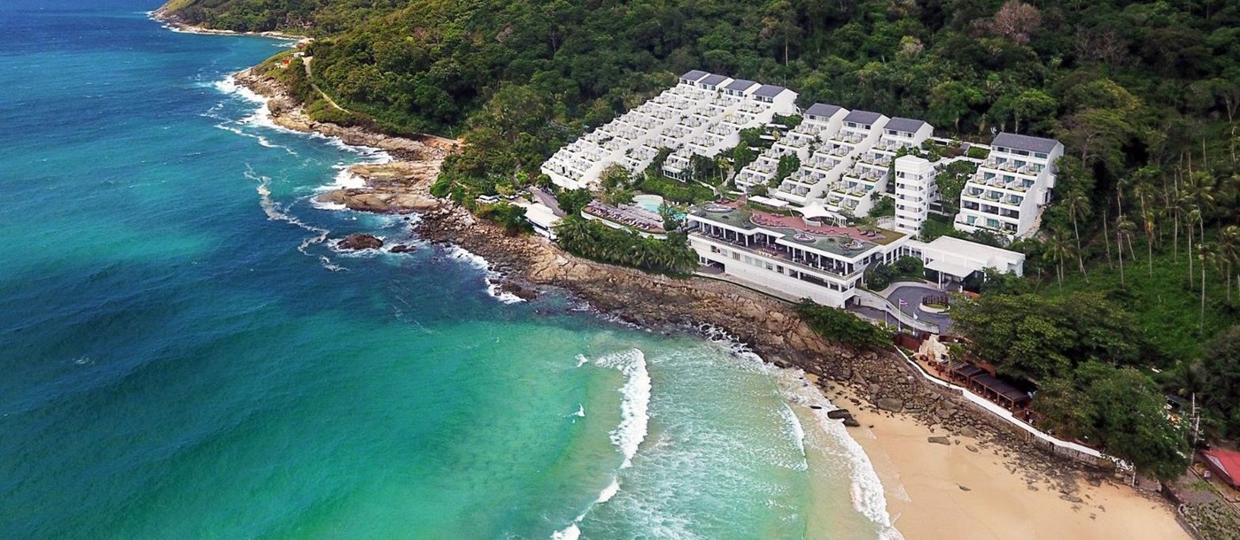 Aerial view of sea, beach and The Nai Harn resort in the Phuket region of Thailand