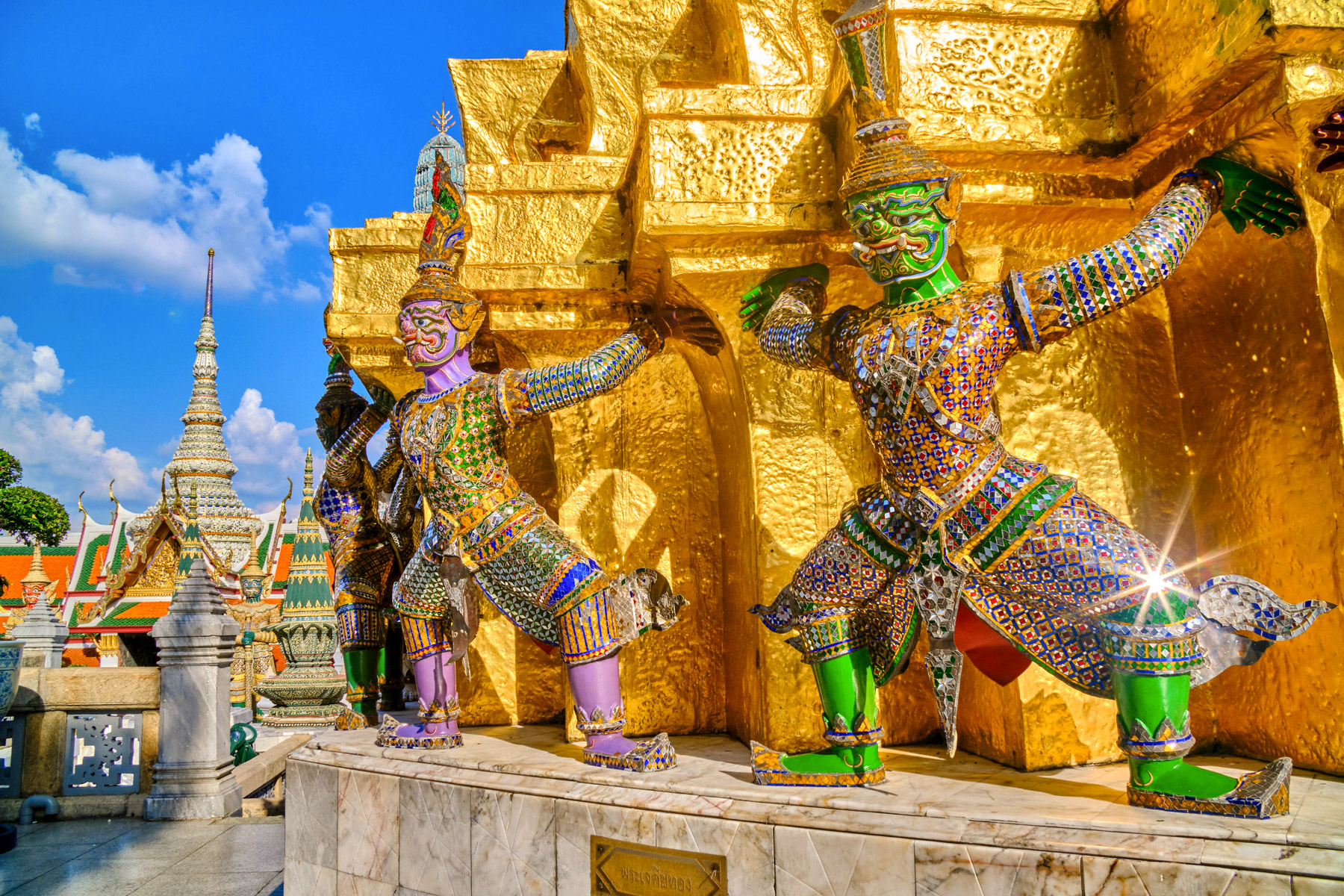 Statues outside the Grand Palace in Bangkok