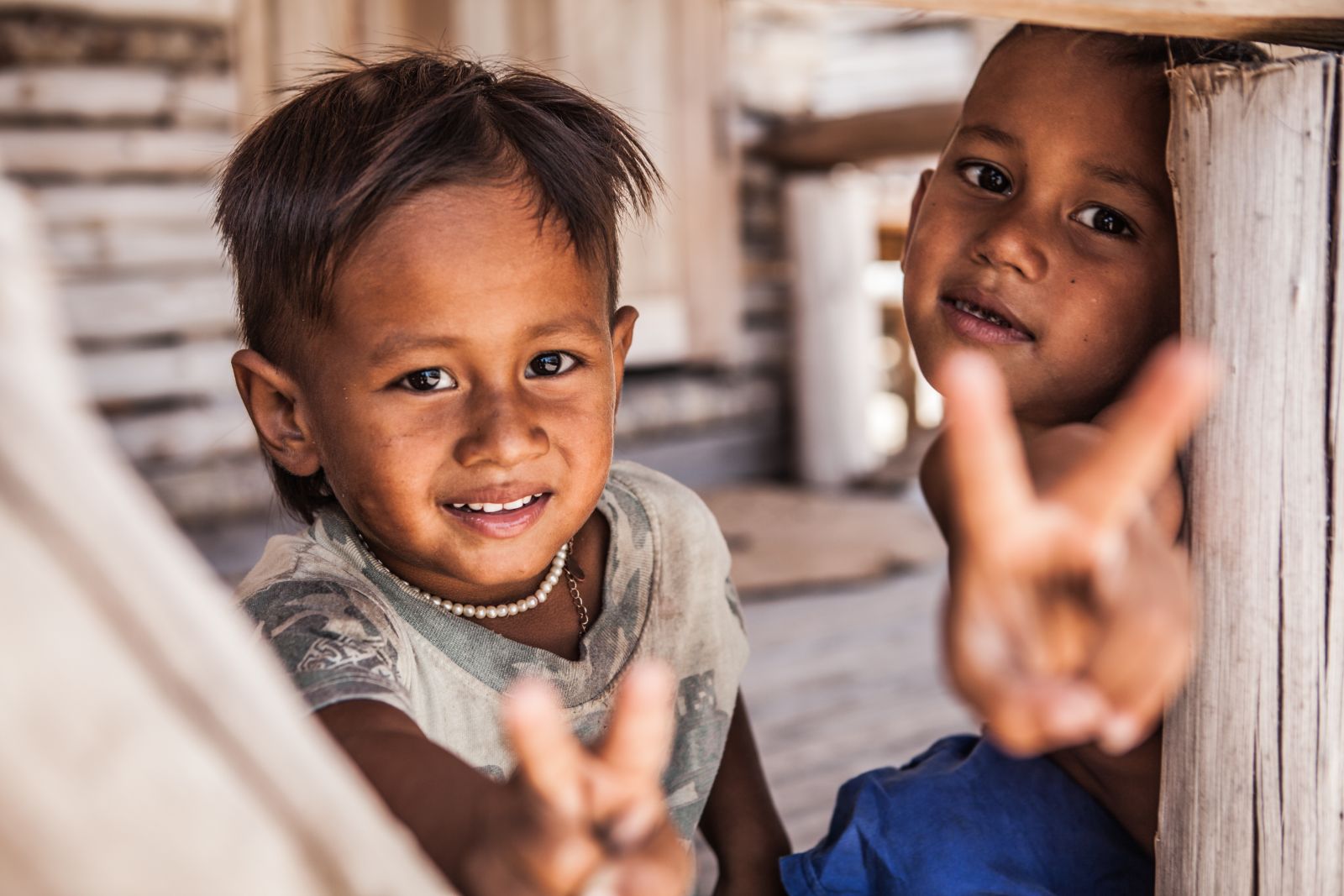 Faces of smiling young children in Chiang Mai, Thailand