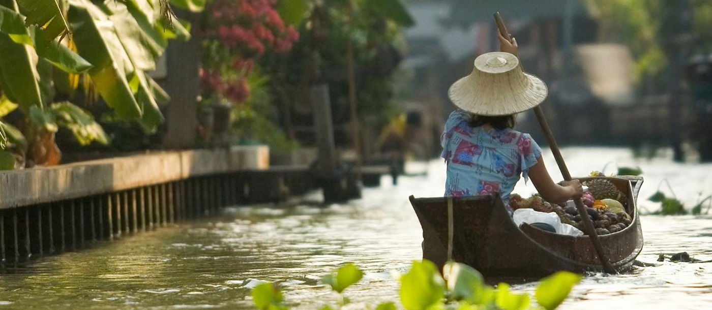 A Thai lady in a boat on the river in bangkok