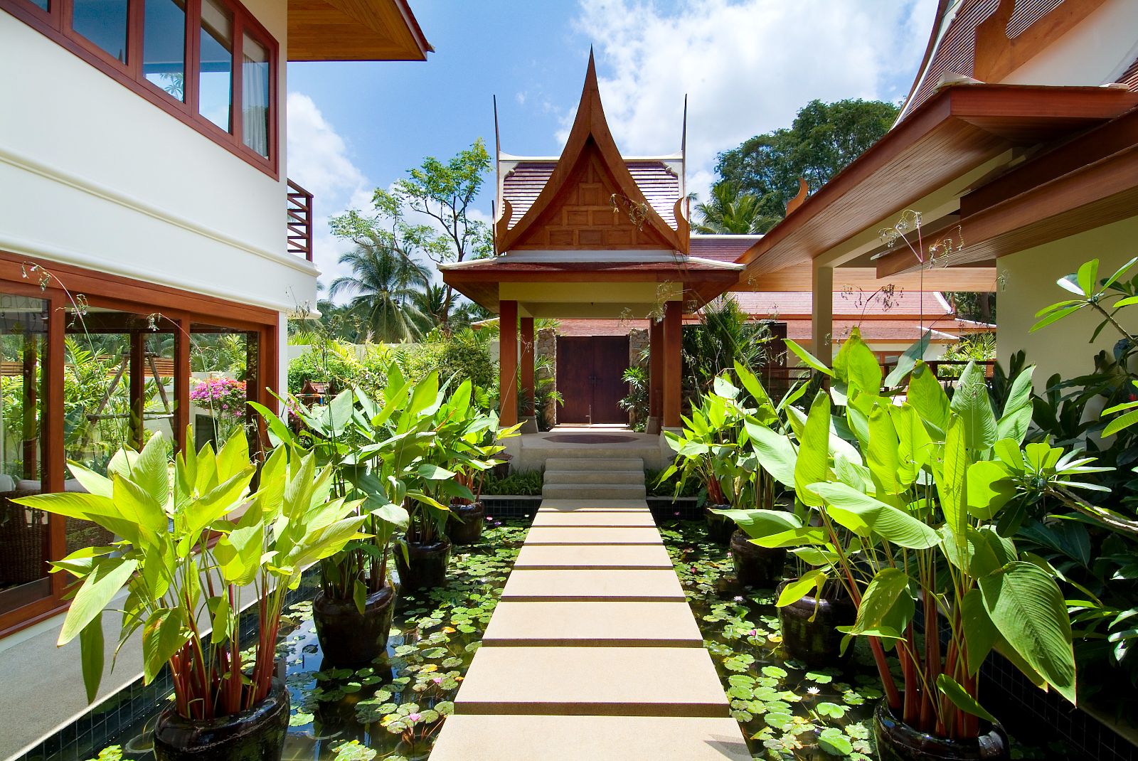 Walkway between salas at Baan Samlarn villa on the west coast of Koh Samui in Thailand