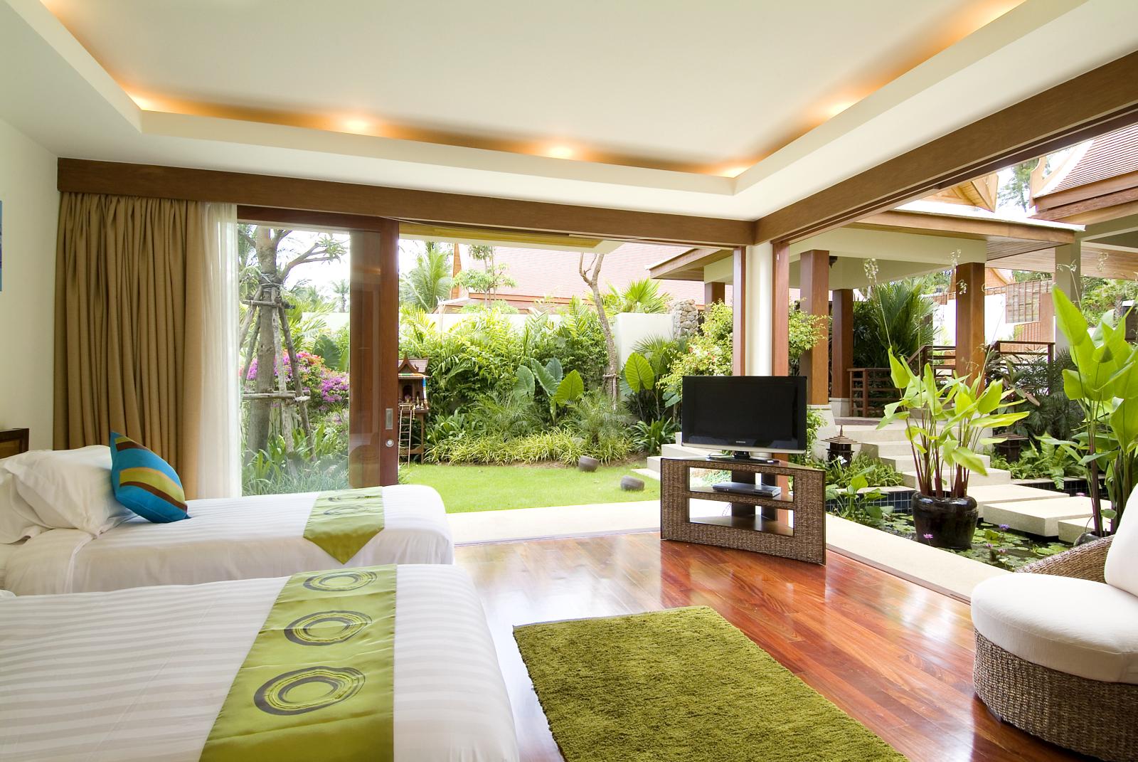 green twin bedroom in baan samlarn, thailand