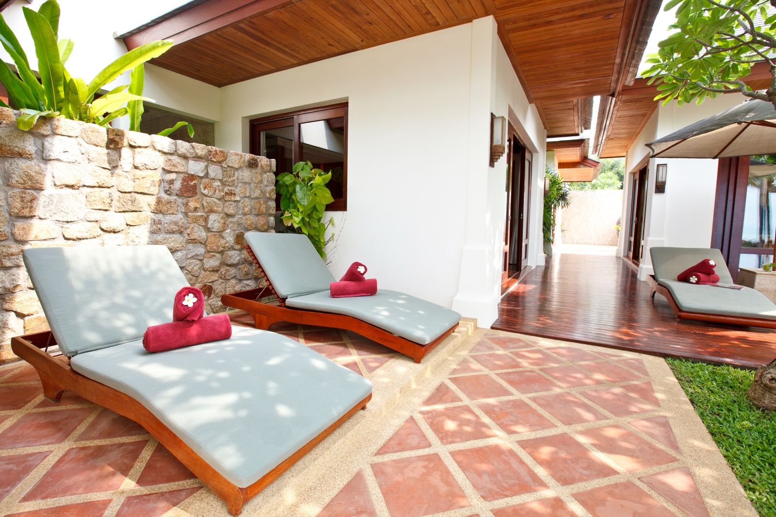 Loungers in the garden of villa Gardenia on Koh Samui in Thailand