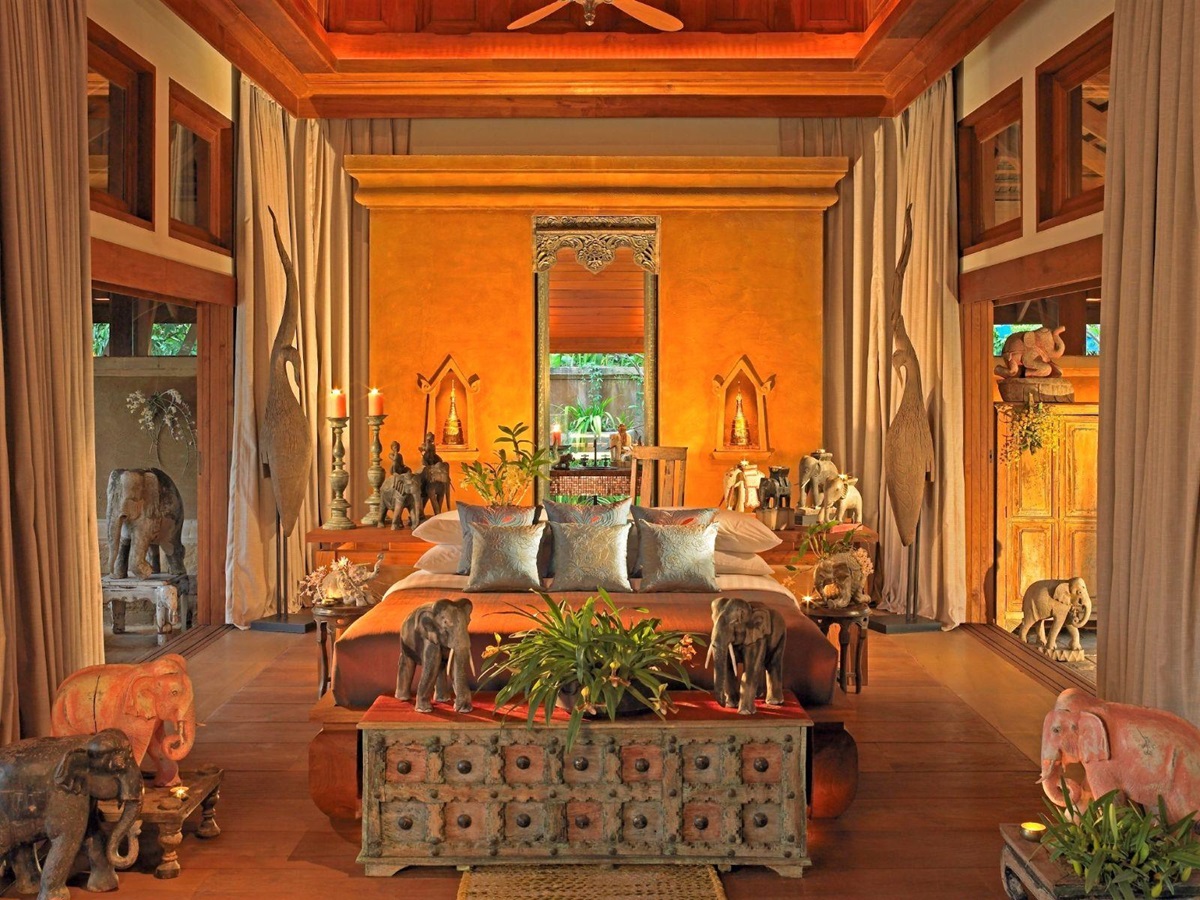 Teak pavilion guest suite bedroom at Howie's HomeStay in Chiang Mai, Thailand