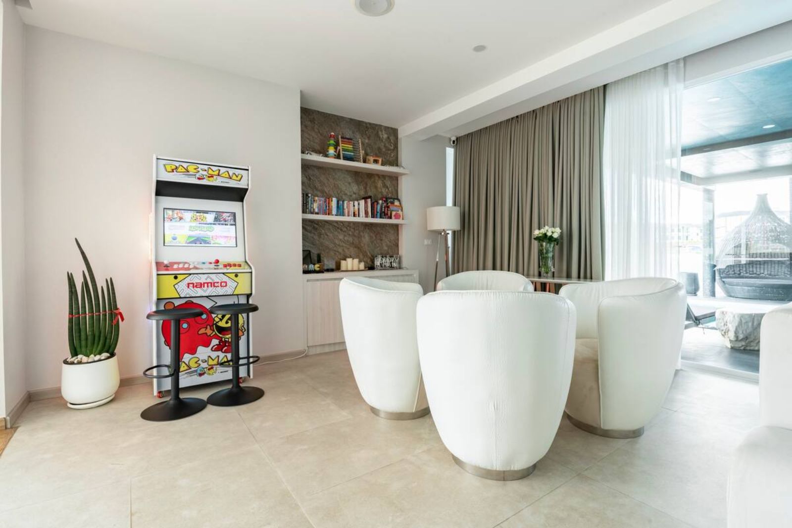 Arcade machine in the living room at Palm Villa in Thailand's Chiang Mai region