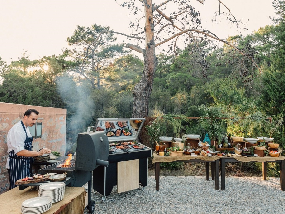 Barbecue at a popup restaurant with a variety of salads, meats and other delicious food at luxury hotel Amanruya, Turkey
