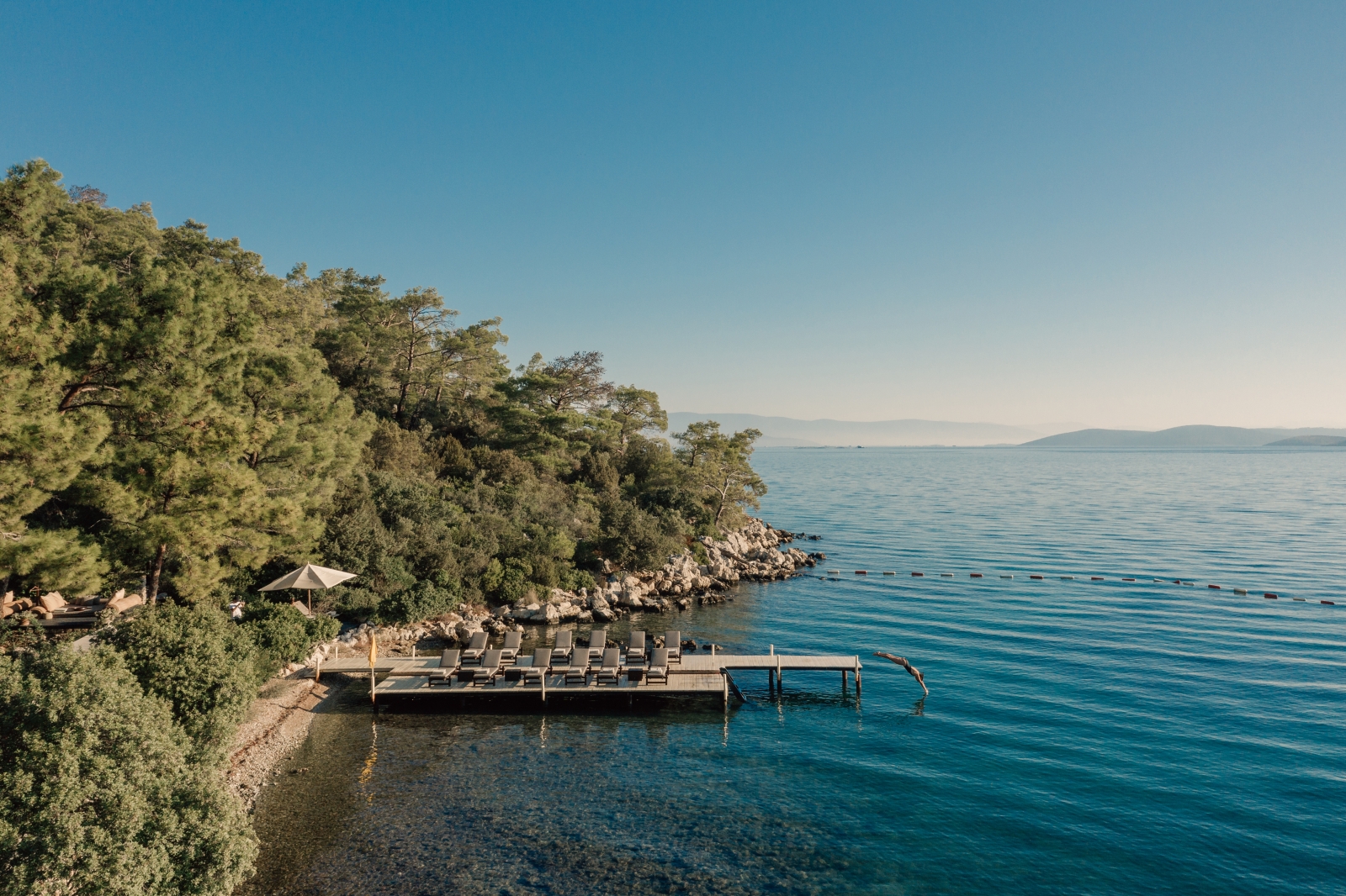 Loungers on a Jetty at the Beach Club at luxury hotel Amanruya, Turkey