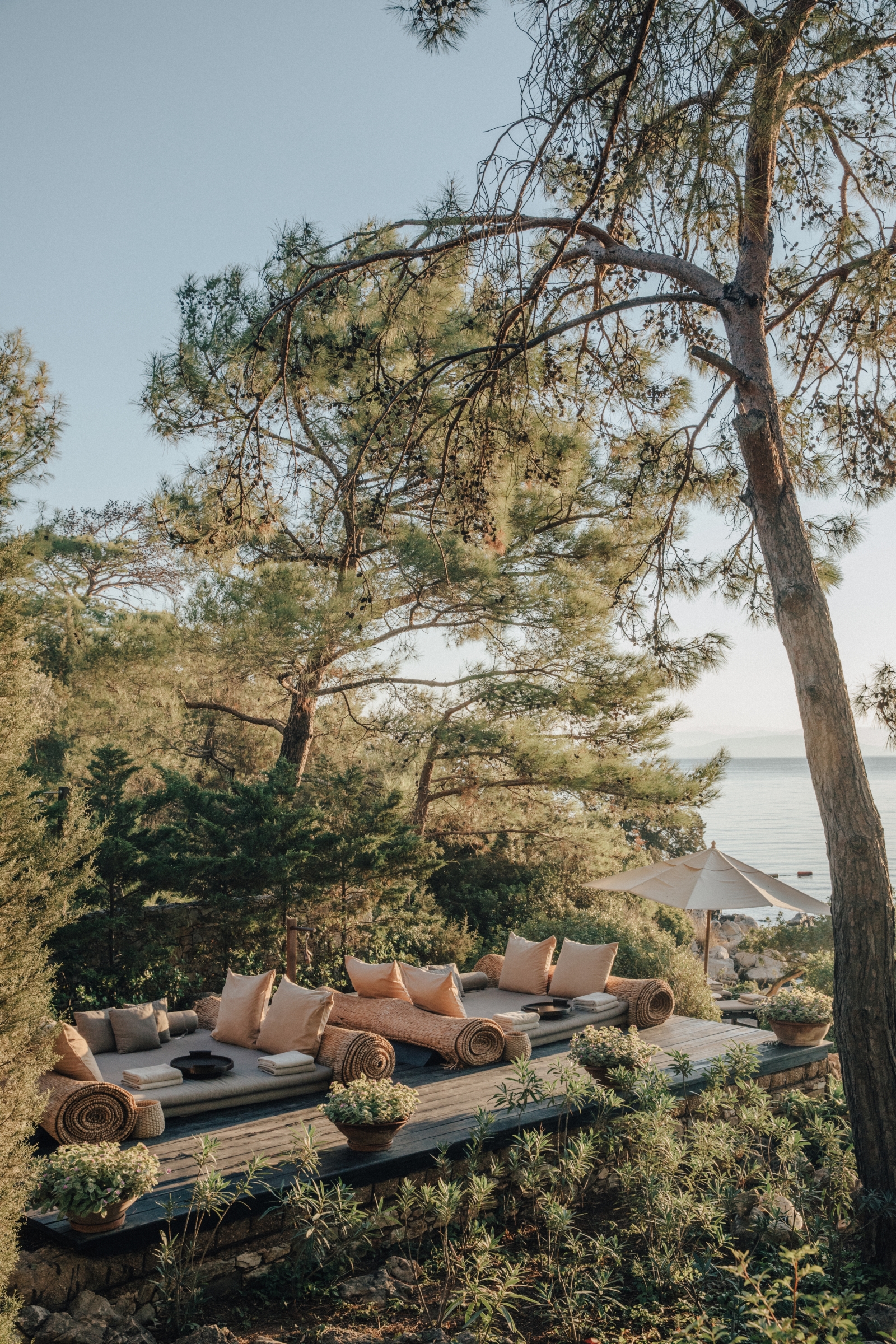 Lounging deck with large sunbeds at the Beach Club at luxury hotel Amanruya, Turkey